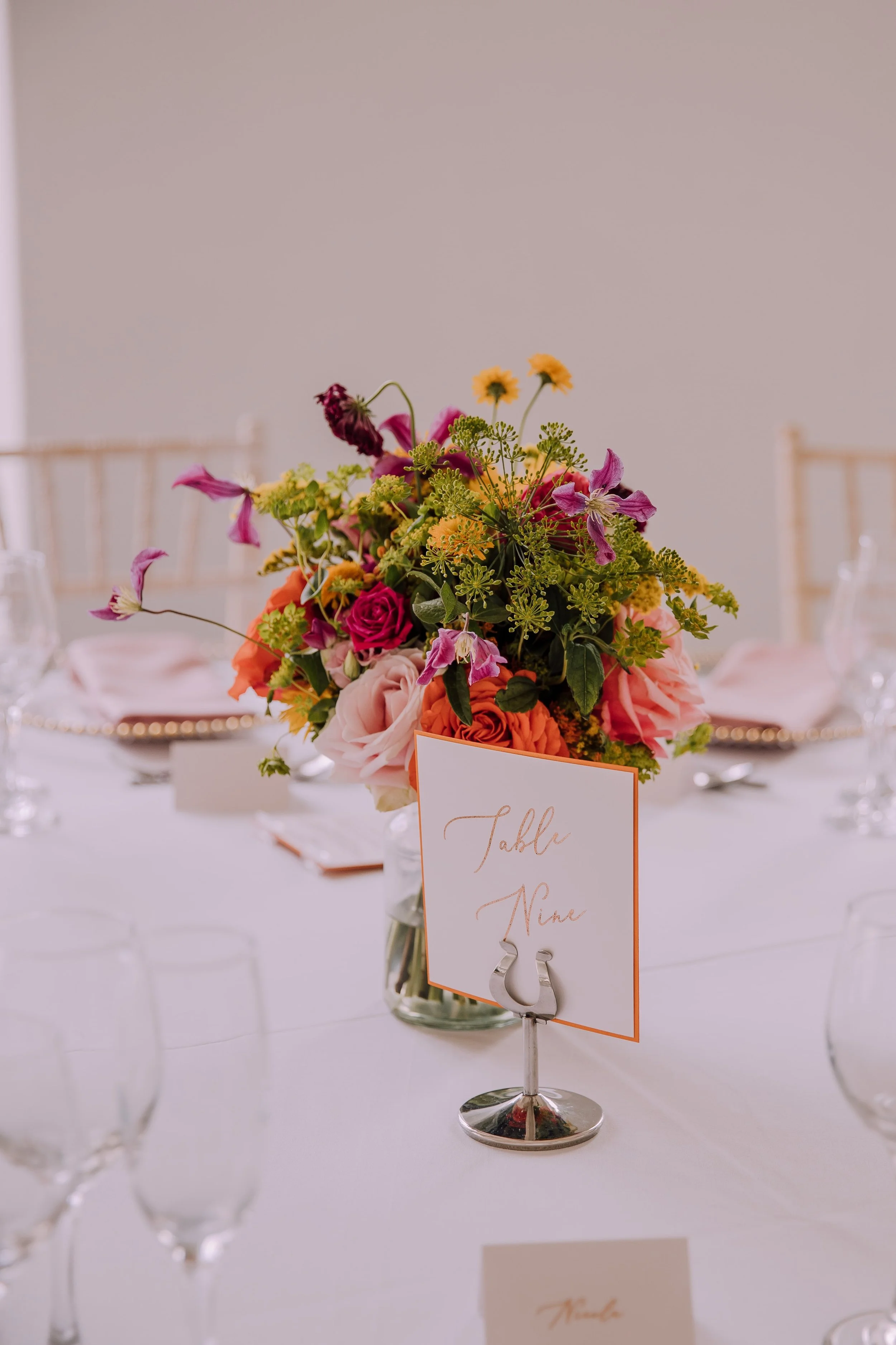 Colourful summer wedding table centrepiece.jpg