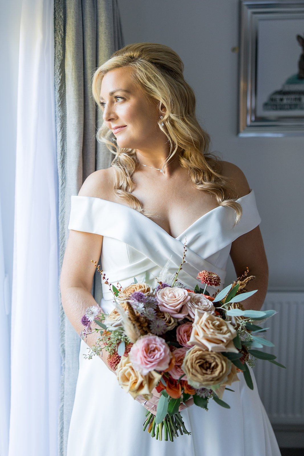 Bride holding bouquet in caffeine tones.jpg