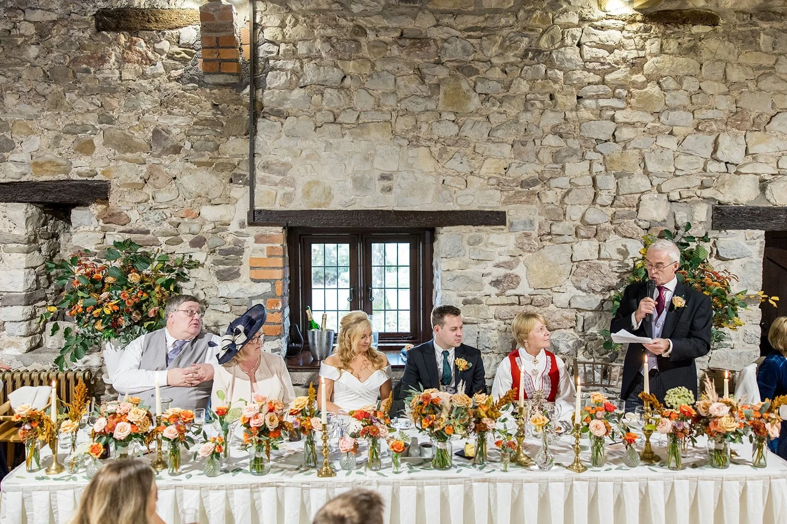 Top table wedding flowers with caffeine coloured flowers.jpg
