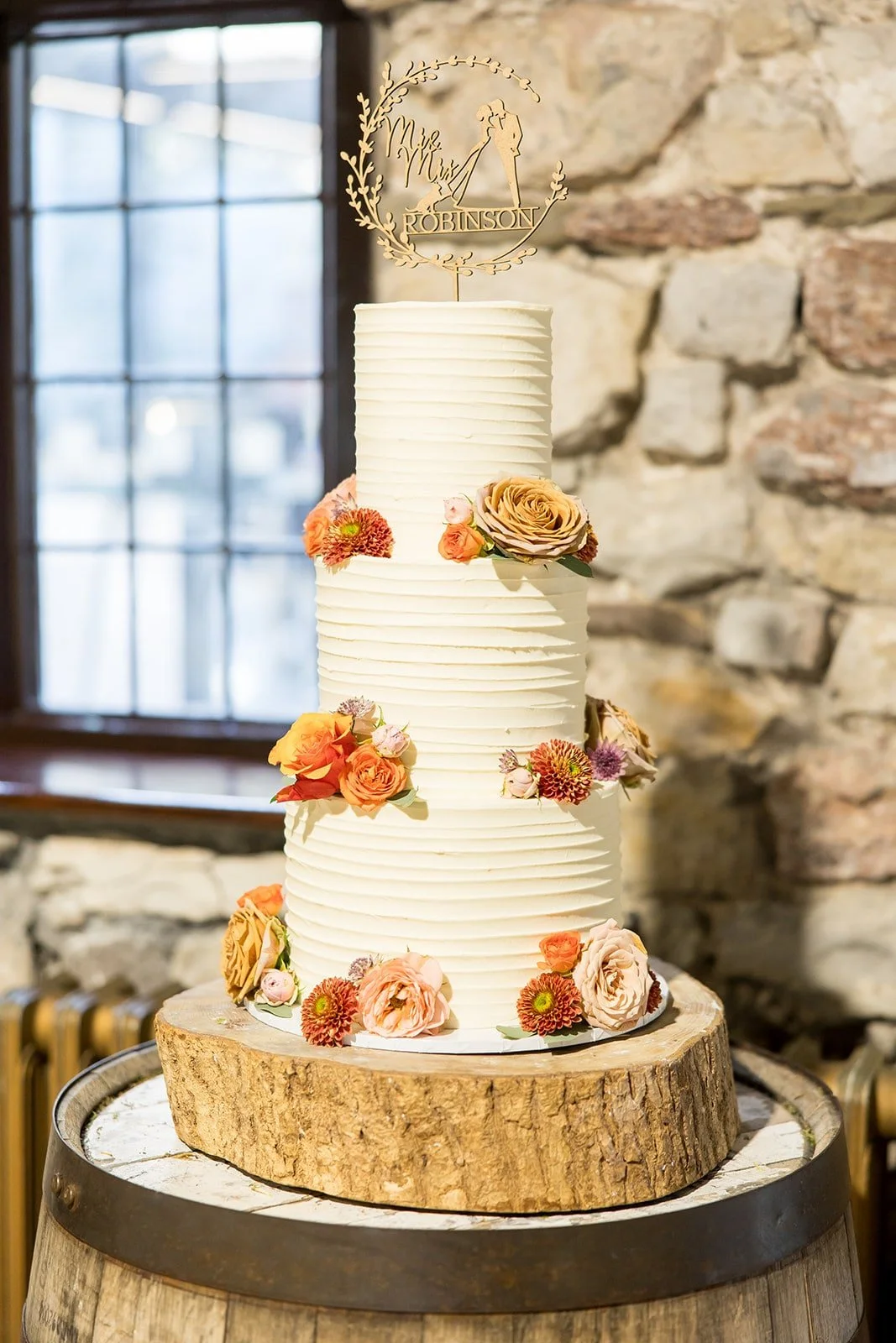 Wedding cake with caffeine coloured wedding flowers.jpg