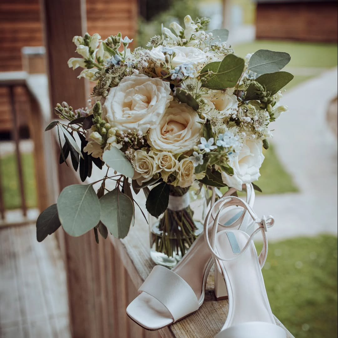Timeless whites. A touch of blue. And flowing foliage.
Proof that simplicity can still feel luxurious.

Natural, effortless wedding flowers &mdash; just as they should feel.

Planning your day?
I would love to bring your vision to life.

Send me a me