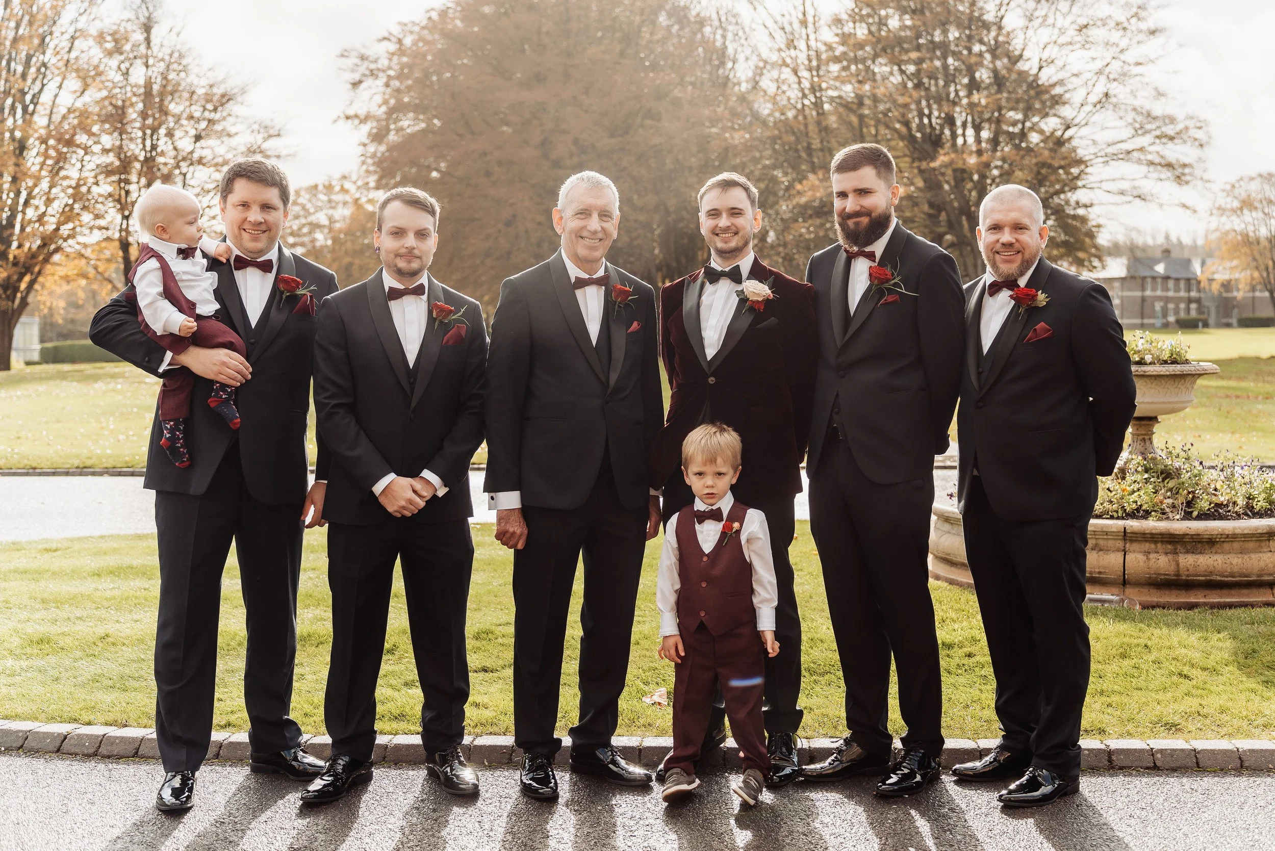 The groomsmen at Hensol Castle wearing red rose buttonholes