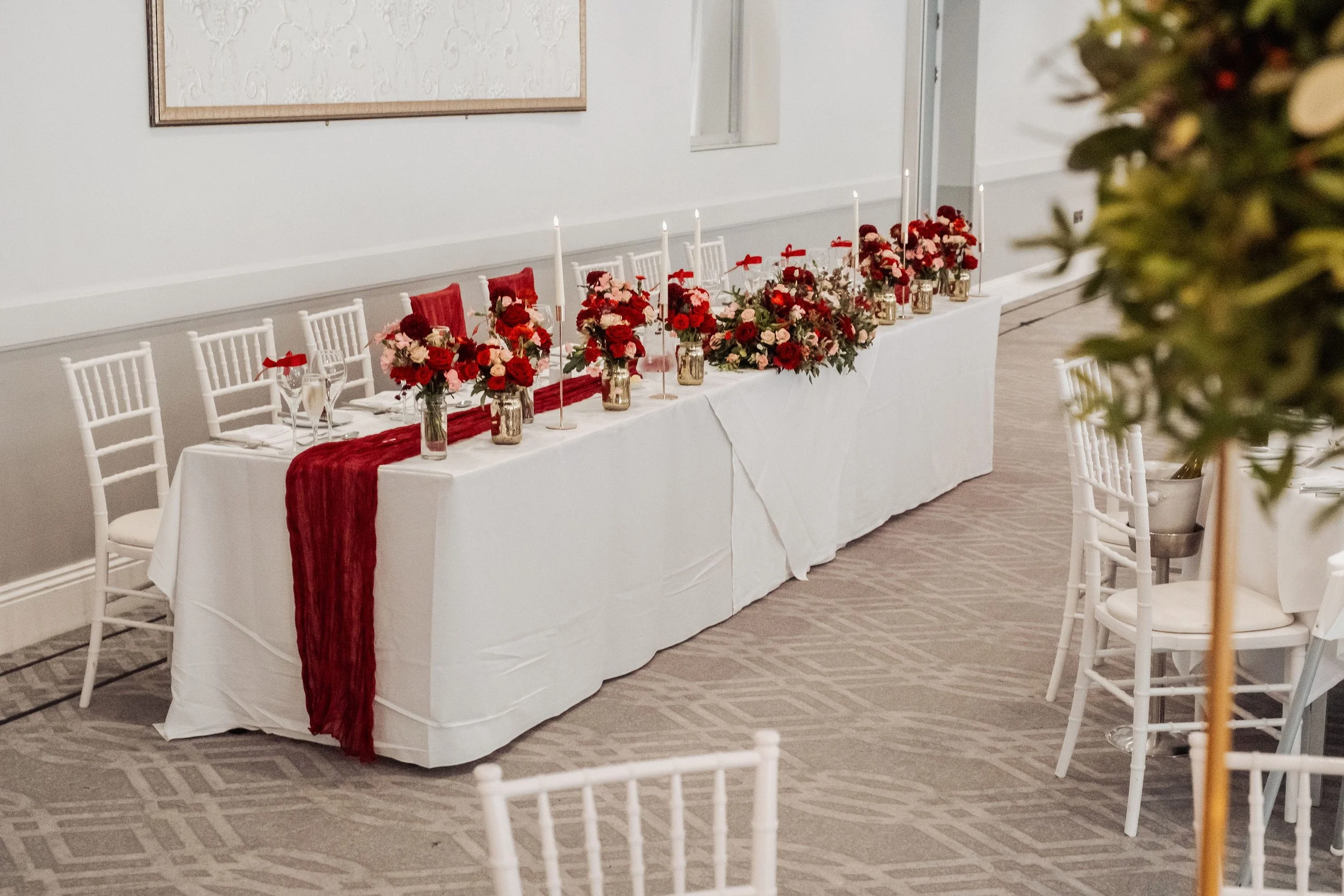 The top table wedding flowers display at Hensol Castle November wedding