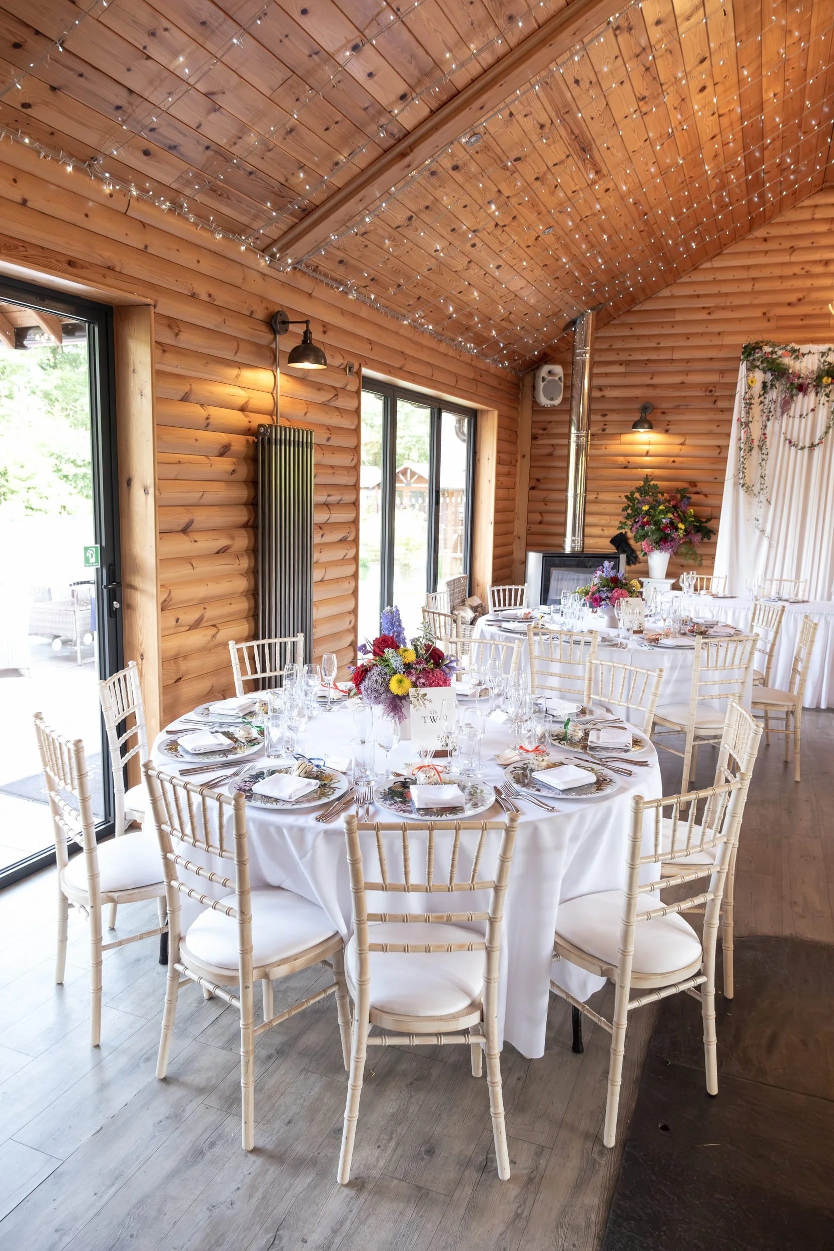 Reception design at Rhodris by the Lake with colourful flowers