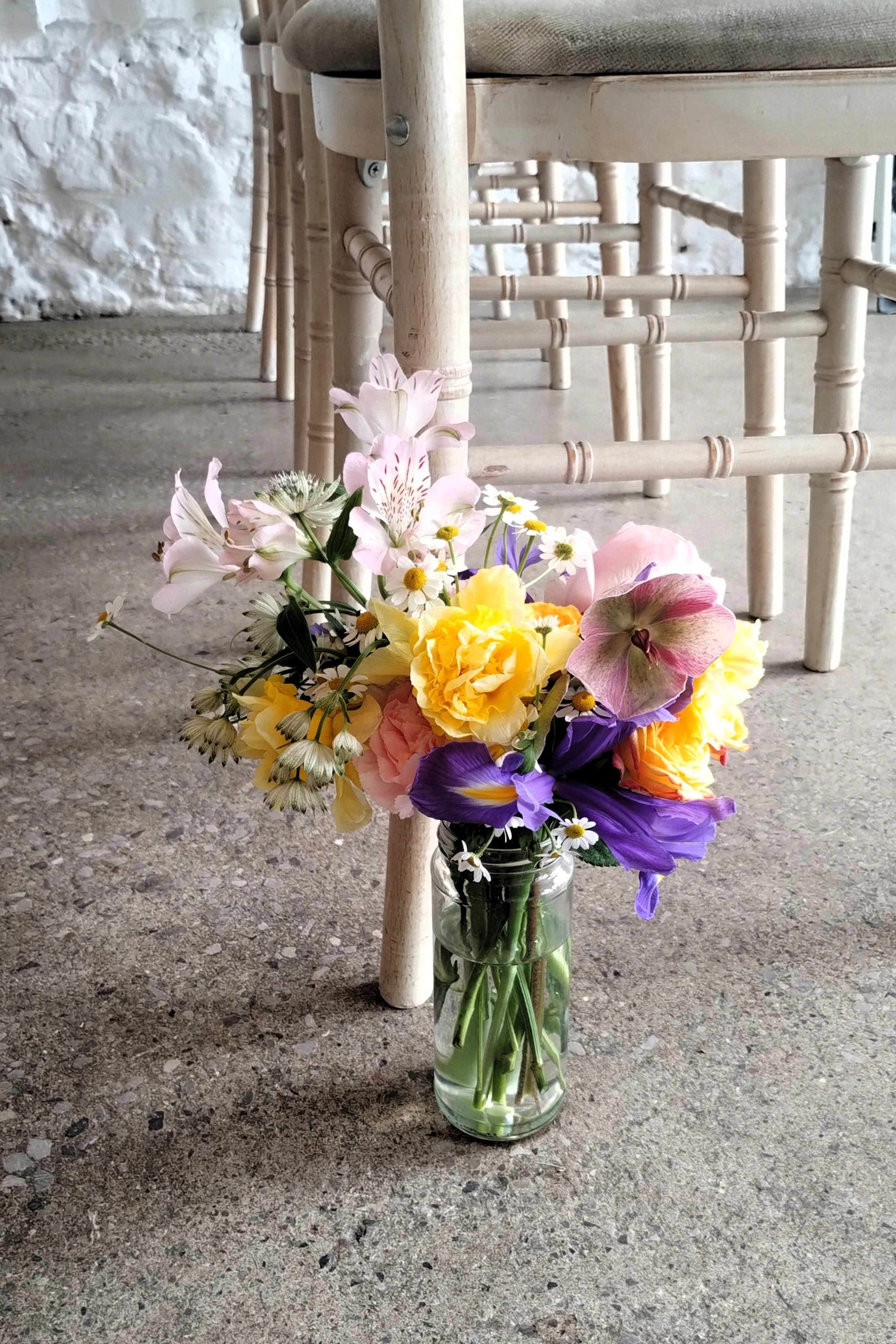 Aisle flowers for Rosedew wedding ceremony full of colourful seasonal spring wedding flowers