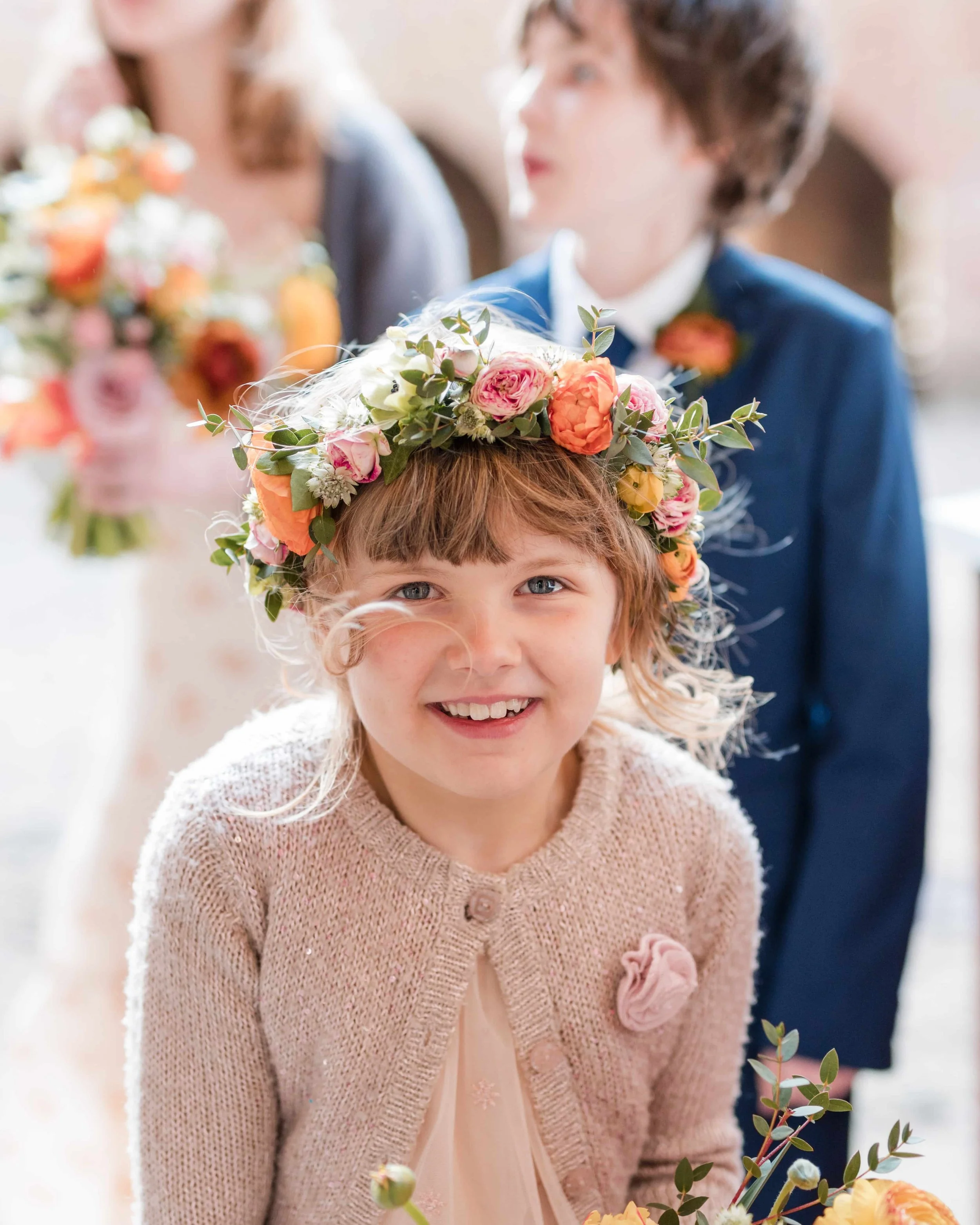 Bridesmaid with spring orange and peach flower crown