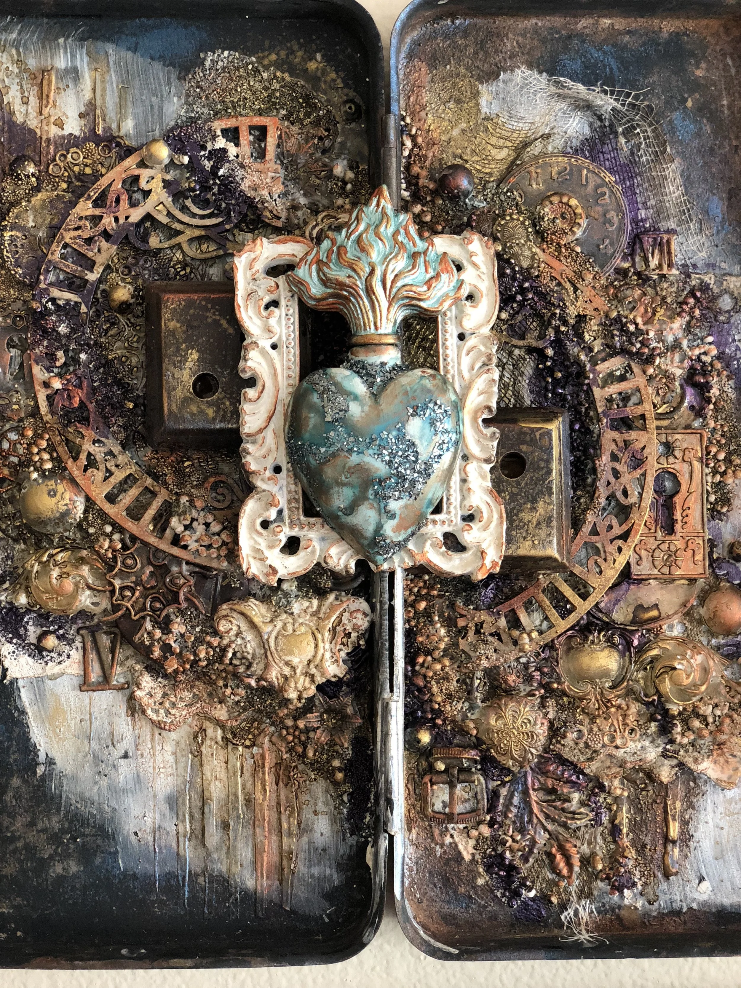  A repurposed antique broken tin was the focus of this piece.  Pulled it out of the trash and reformed it into a vintage steampunk look that I love!  Trash to Treasure! 