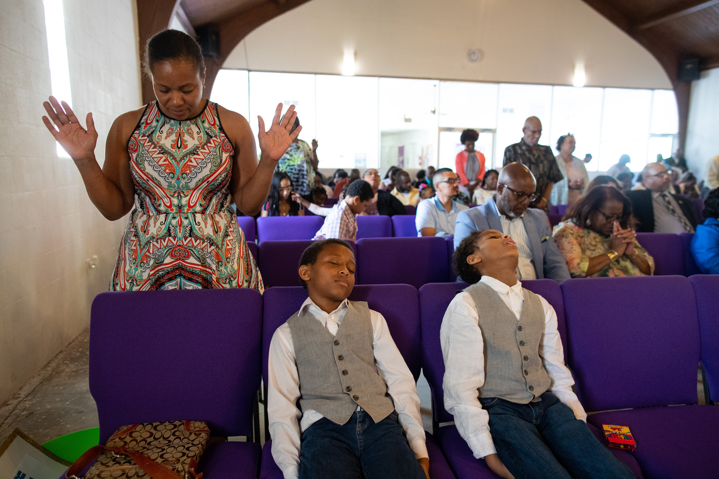  Angela Davis prays a two young boys sleep during Easter's services the Brooks AME Worship Center on Sunday, April 21, 2019. Brooks AME Worship Center has chosen to stay in the Hillcrest neighborhood. 