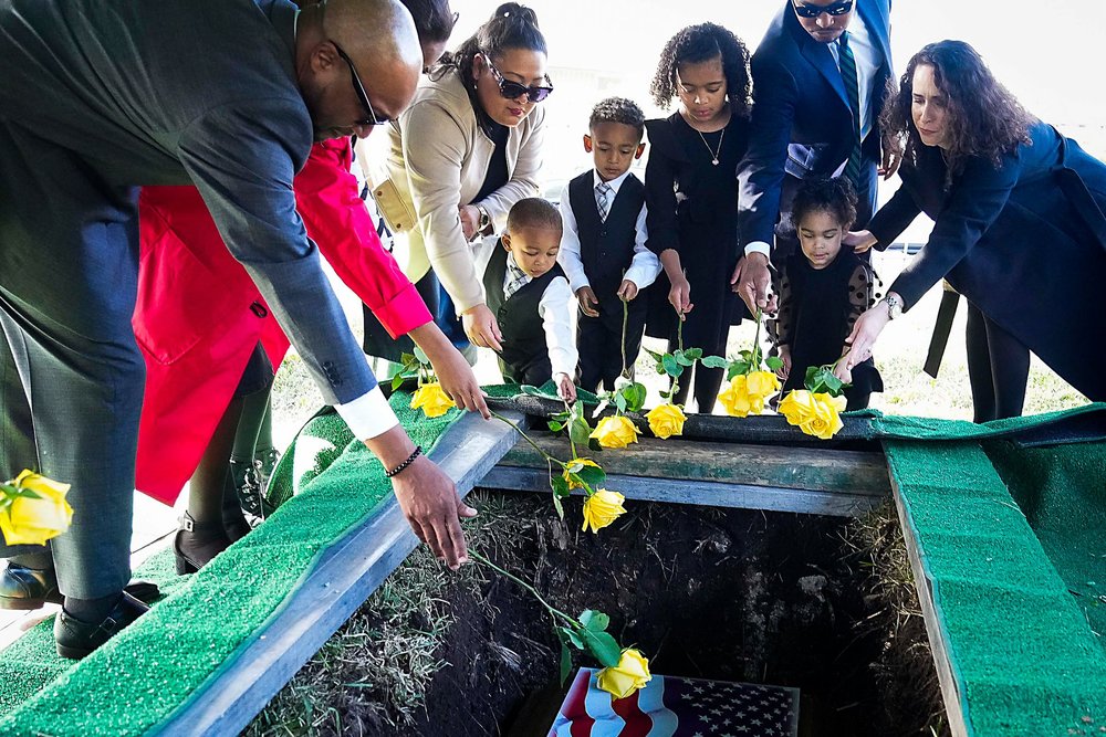  The grandchildren and great-grandchildren of of former U.S. Rep. Eddie Bernice Johnson toss yellow roses into the late congresswoman’s grave during burial services at the Texas State Cemetery on Wednesday, Jan. 10, 2024, in Austin. 