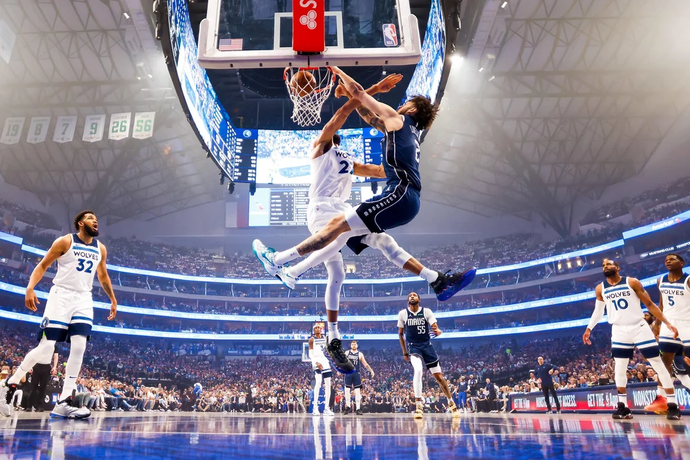  Dallas Mavericks center Dereck Lively II (2) dunks the ball past Minnesota Timberwolves center Rudy Gobert (27) during the first half in Game 3 of the NBA basketball Western Conference Finals on Sunday, May 26, 2024, in Dallas. 