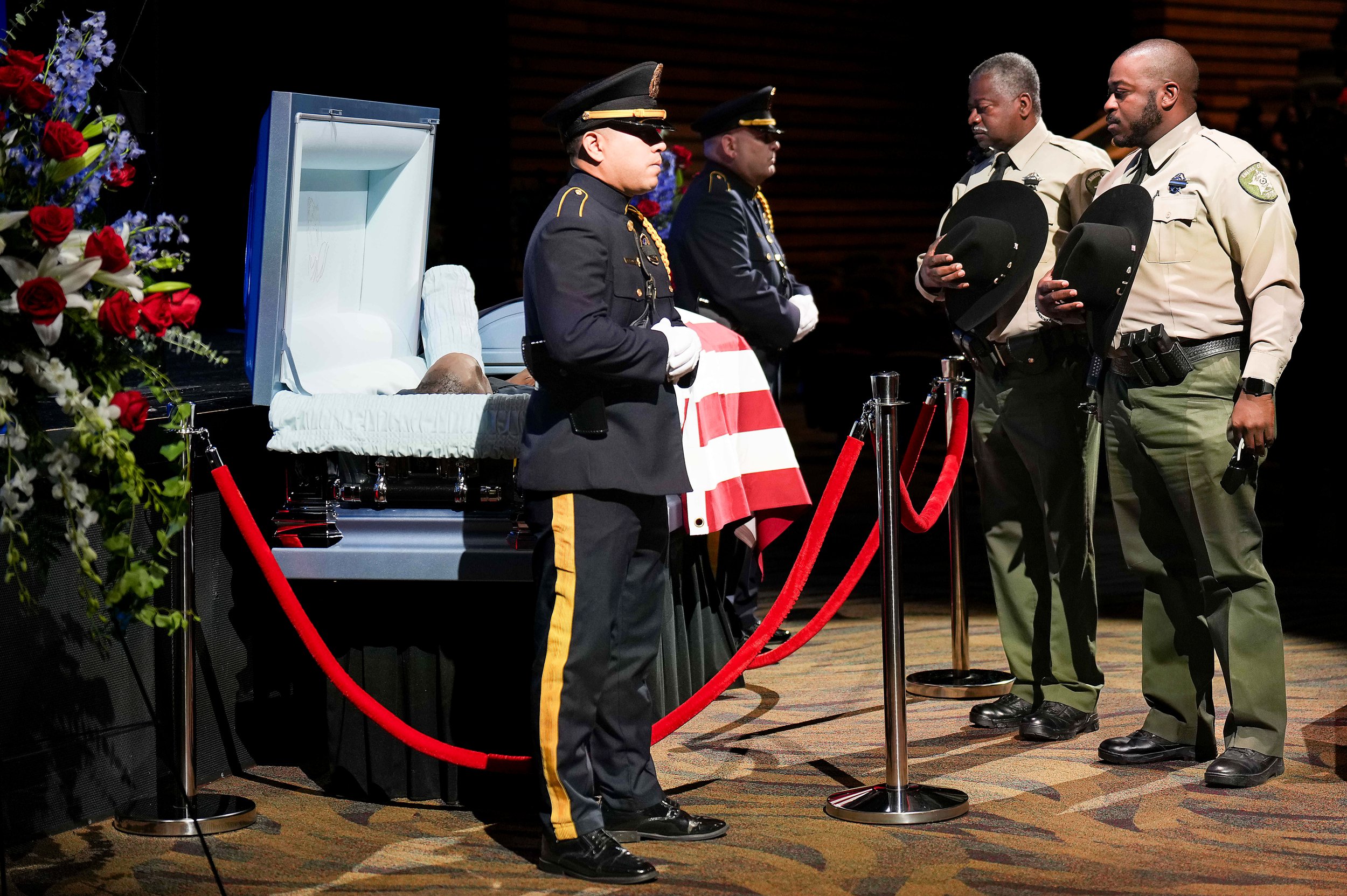 Navarro County Sheriffs Deputies pause at the casket of Dallas police officer Darron Burks before funeral services at Watermark Community Church on Saturday, Sept. 7, 2024, in Dallas. Burks was shot and killed in Oak Cliff on Aug. 29.