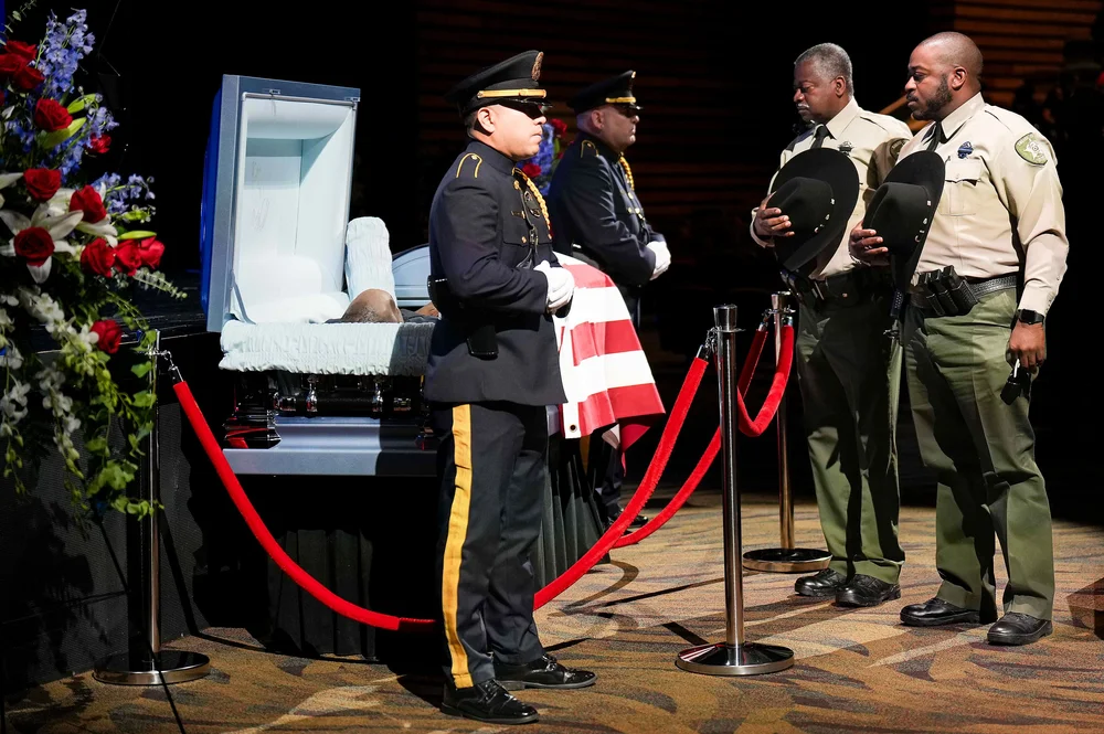  Navarro County Sheriffs Deputies pause at the casket of Dallas police officer Darron Burks before funeral services at Watermark Community Church on Saturday, Sept. 7, 2024, in Dallas. Burks was shot and killed in Oak Cliff on Aug. 29. 