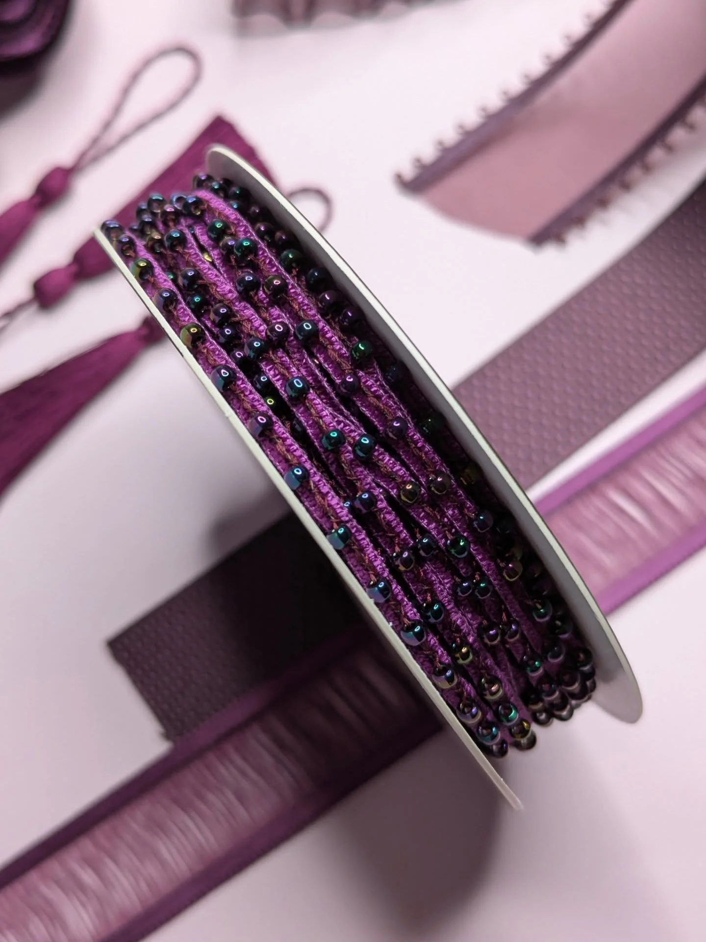 Aubergine, a rich, earthy purple, is doing the trendy colour rounds.  A blend of burgundy and chocolate-brown, this deep and expensive-looking shade of purple gives a rich, regal appeal to your AW25 aesthetic.

#mokuba #mokubaribbon #trimshop #regalp