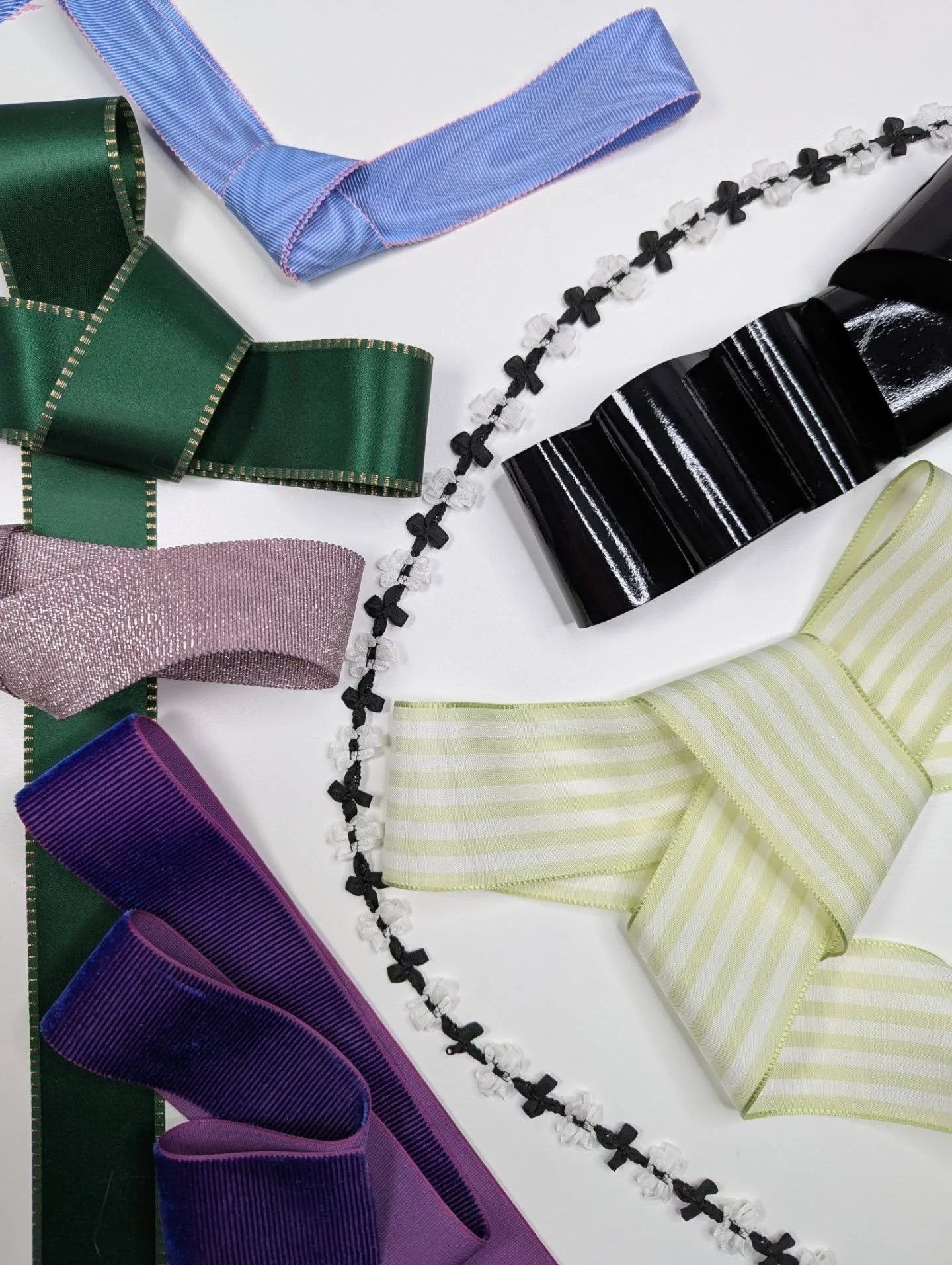 Bow detailing may initially seem intimidating, especially with the exaggerated versions that recently dominated the runways.  That said, this eye-catching feature is much easier to style than you think.  Rooted in playful romance with a hint of '80s 