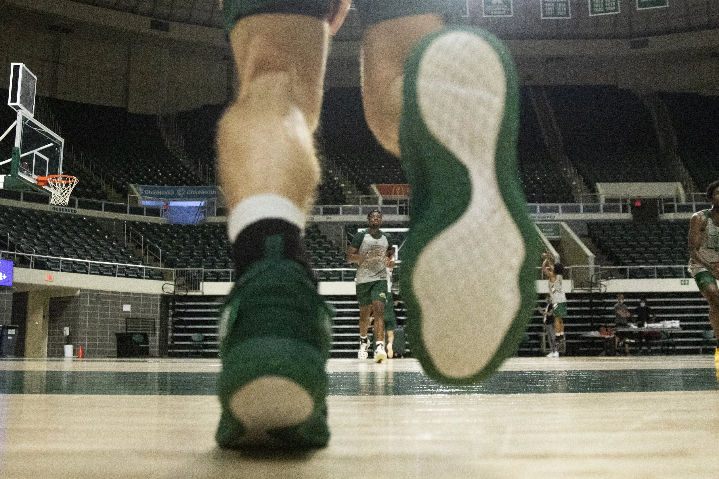  Ohio freshman I.J. Ezuma (10), runs sprints during practice after a drill. These sprints are meant to get the players conditioned to game speed.  