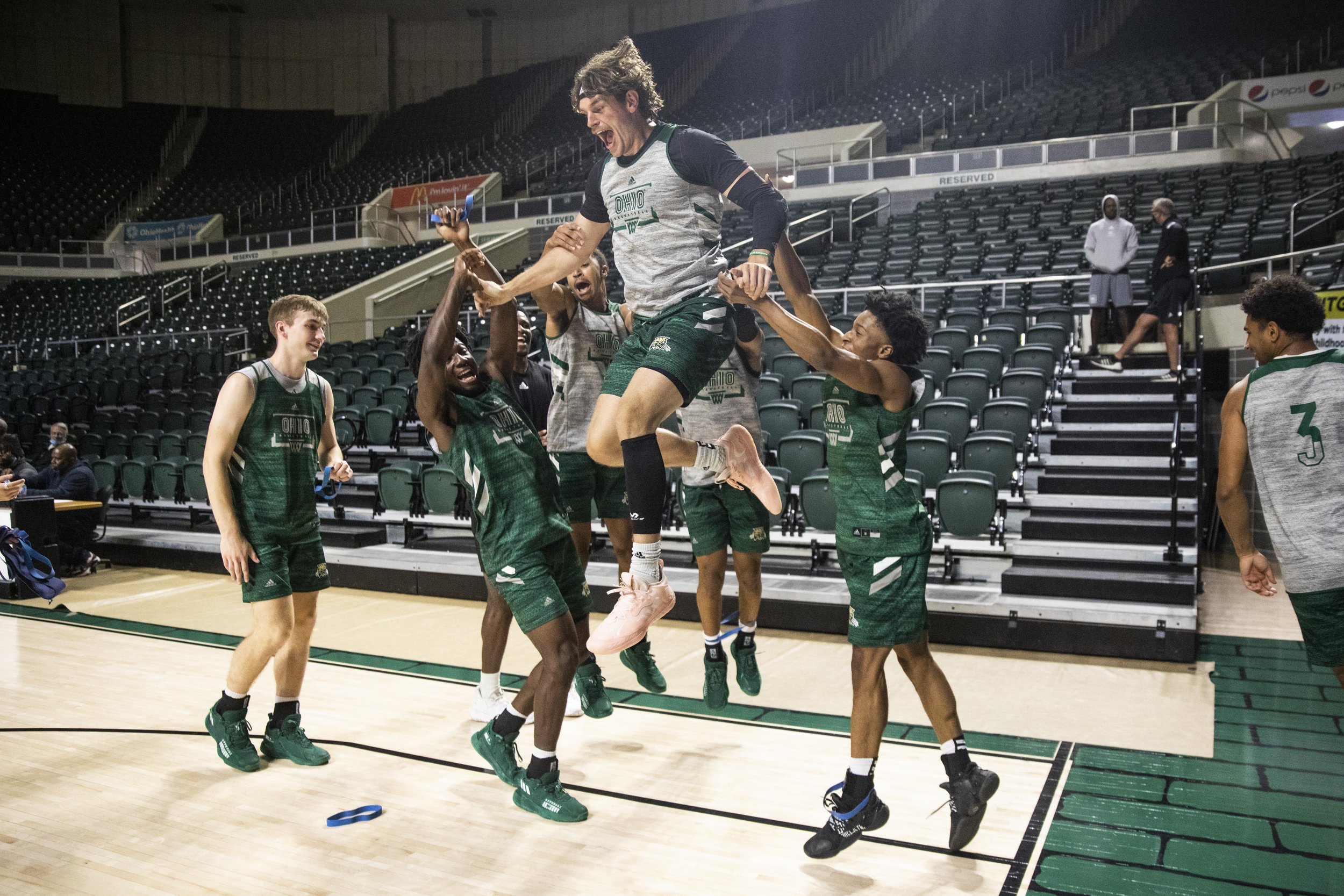  After band work for warmups, the team hypes up senior Ben Vander Plas (5) as warmups end and team drills begin.  
