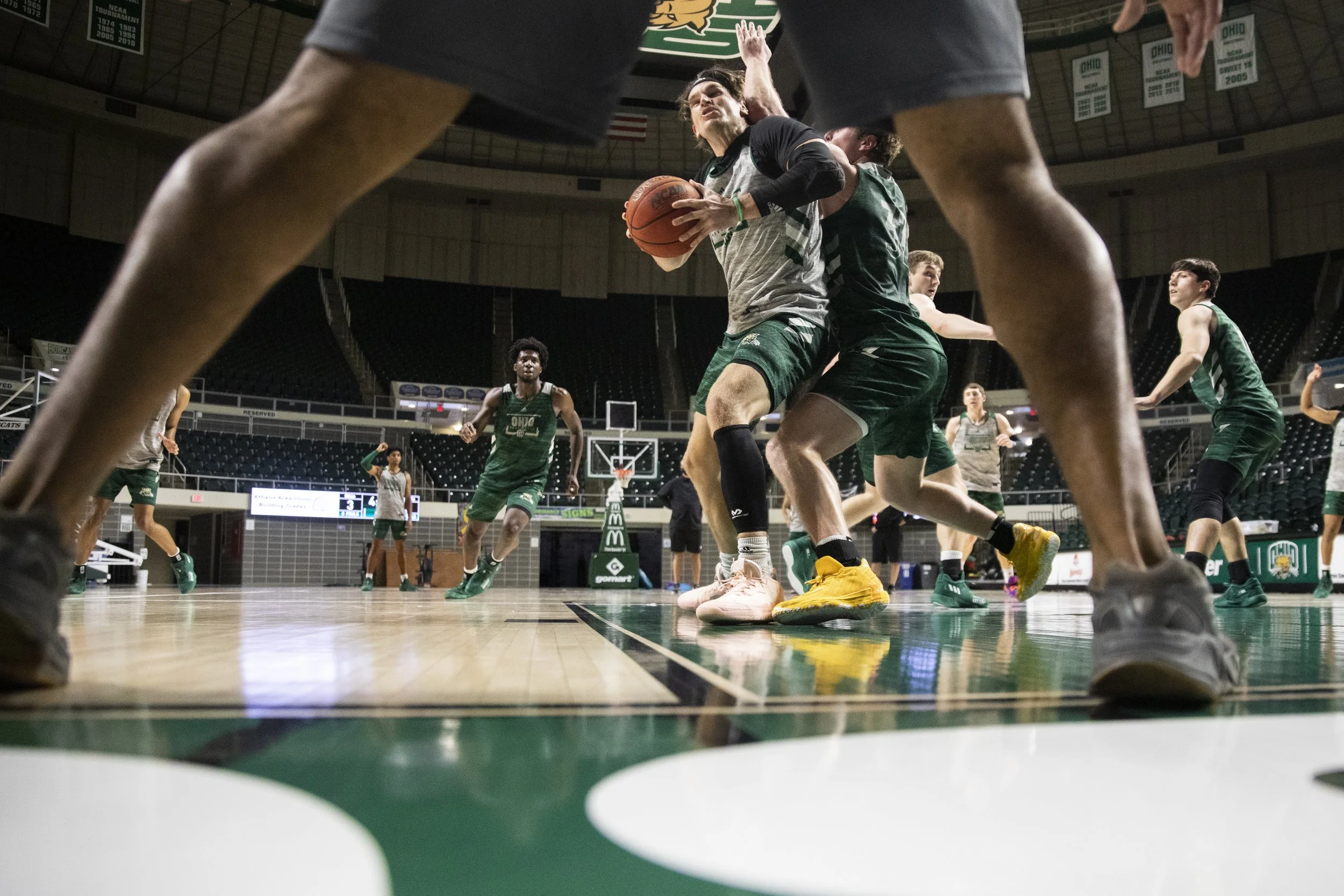  Coach Lamar Thornton watches Ben Vander Plas attempt a contested shot during a drill.   