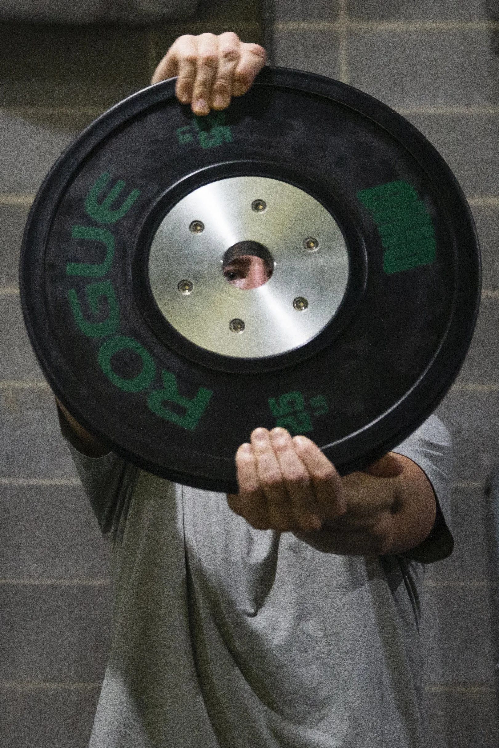  Jason Carter (30) preforms a shoulder exercise with a plate during an optional Wednesday lift. Wednesday lifts are optional to where players can come in and workout , receive treatment or come in and put up shots on their own time.  