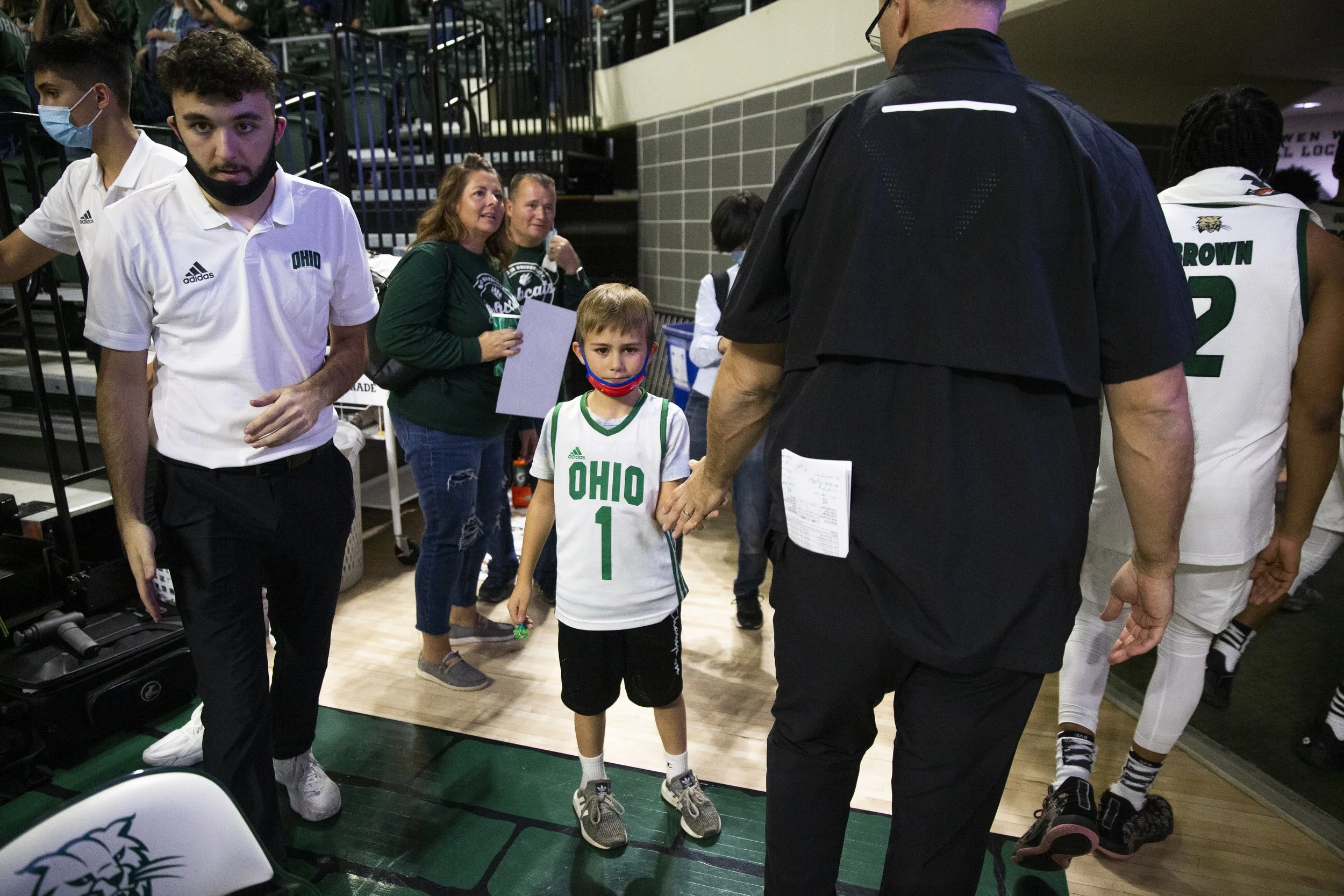 Ohio Head Coach, Jeff Boals, greets a young fan after the game on his way back to the locker room.  