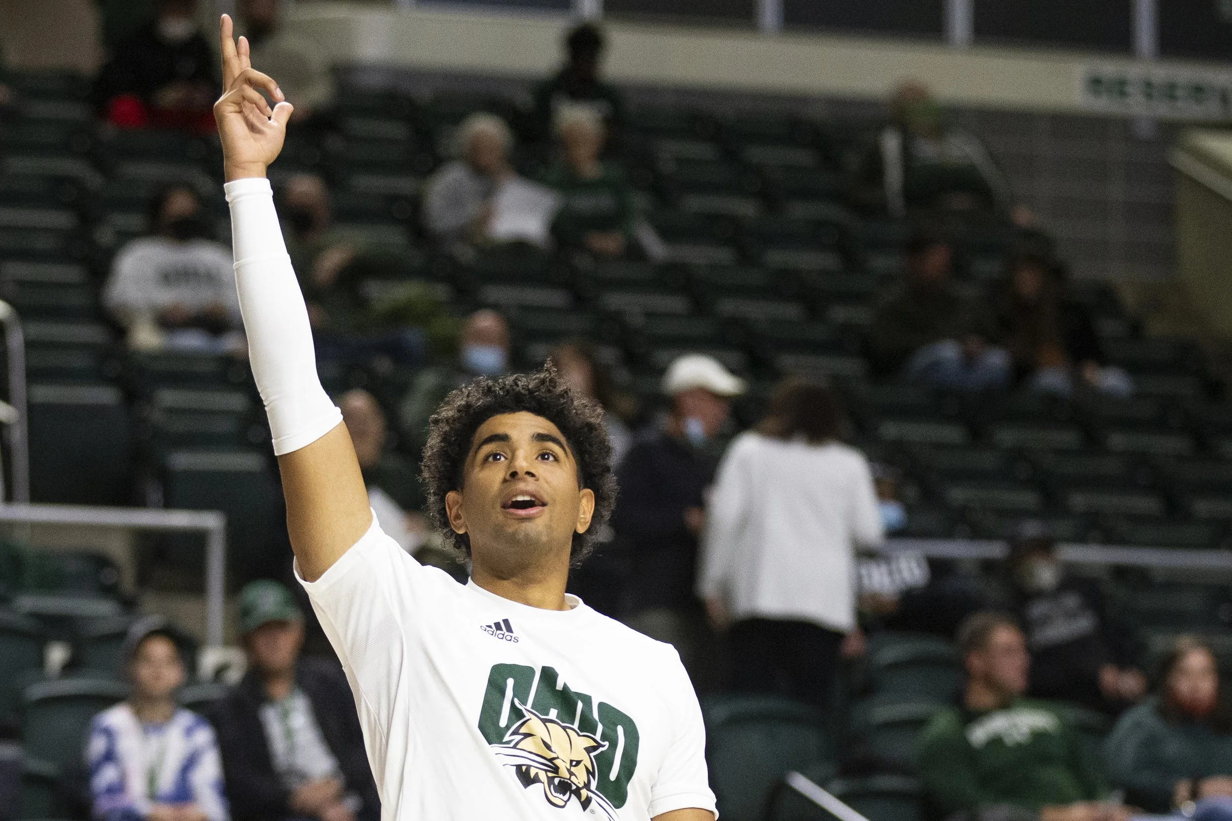  Ohio forward Ben Rodrick (3) reacts to a shot during warmups prior to the Capital game.  