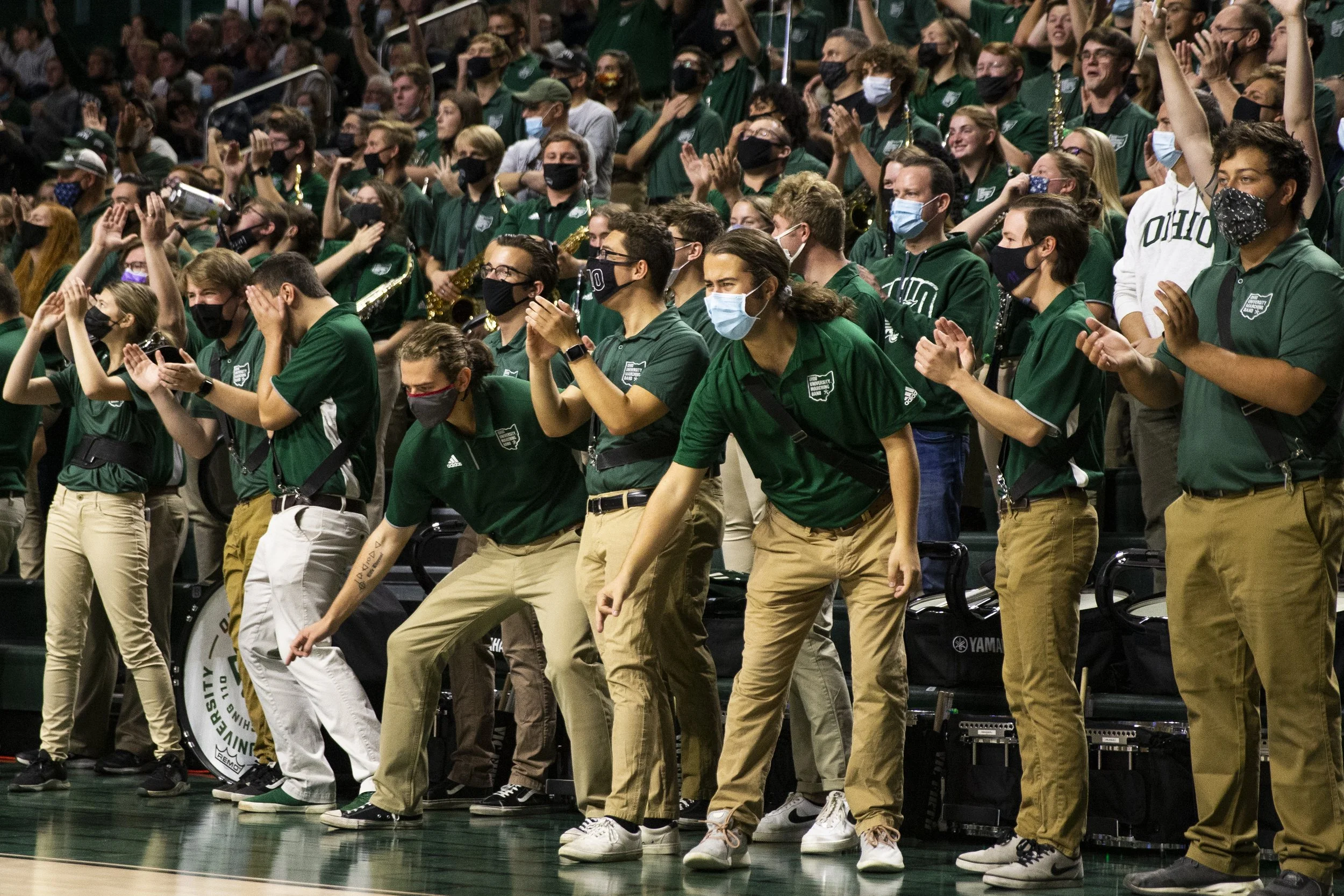  The Marching 110 reacts to a three pointer in the first half of the game. Like the “Bench-Mob,” the Marching 110 plays a large role in the energy that is brought into the Convo for game day. The band cheers hard for the Bobcats and jeers even harder