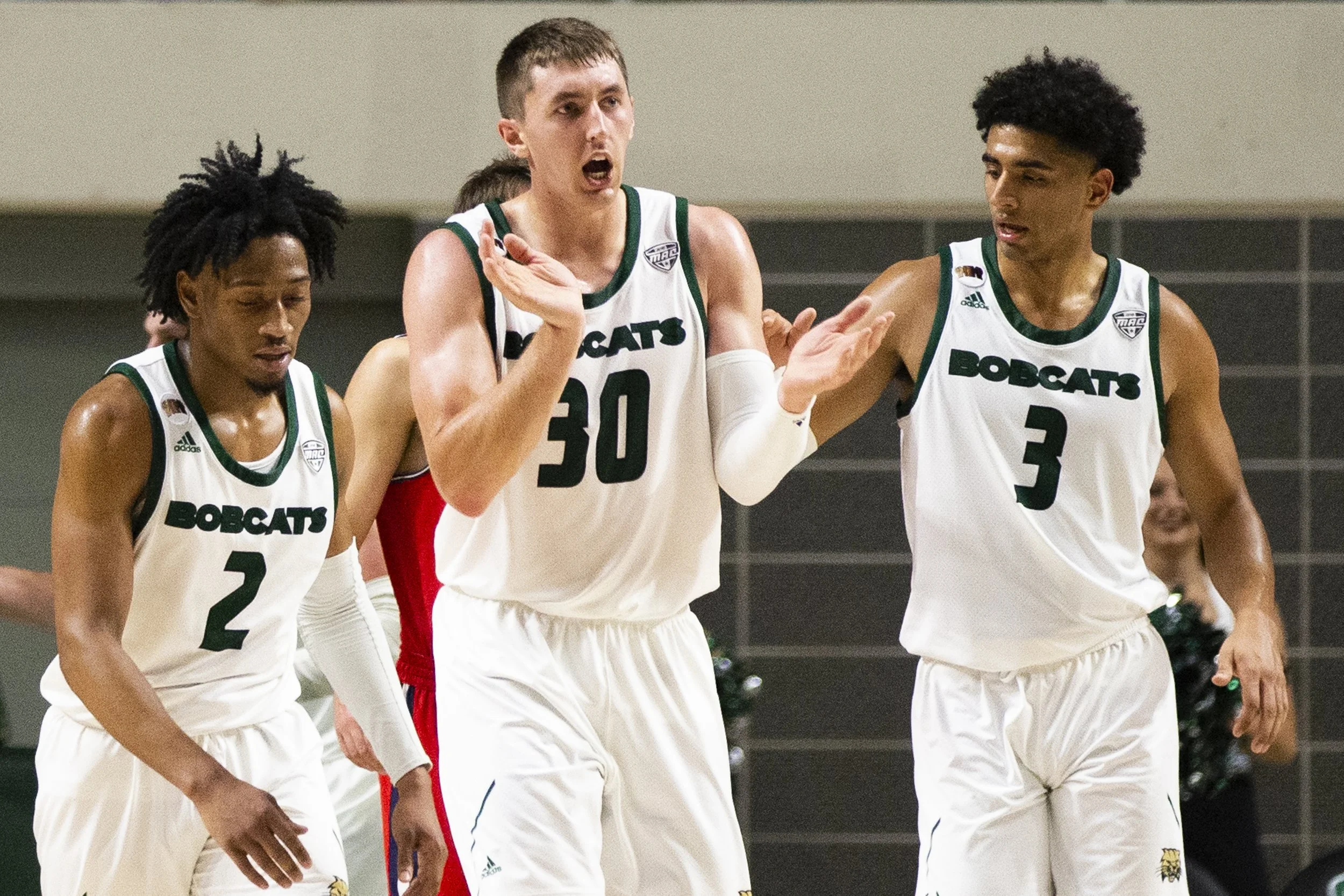  Jason Carter celebrates after a three pointer in the first half of the Belmont game. Carter was brought back to Athens, as a 3-point specialist.  