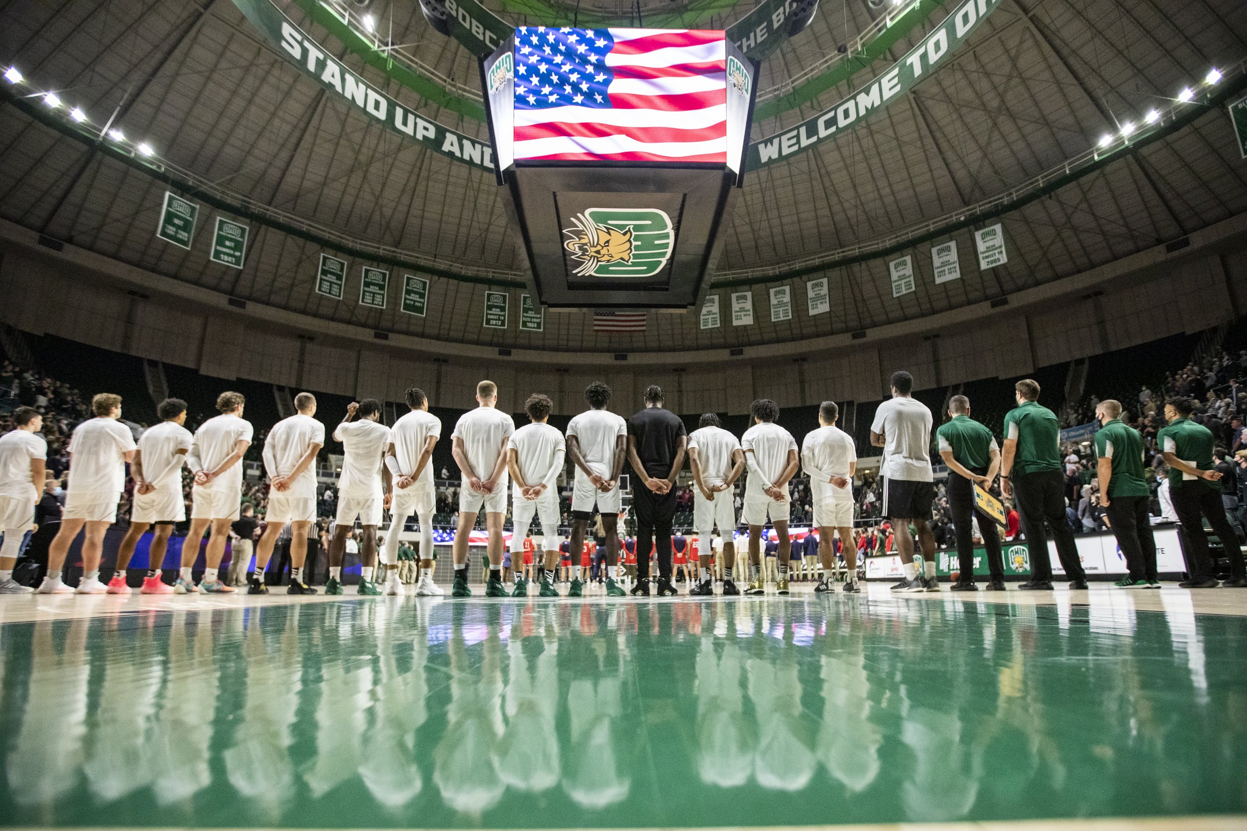  The Ohio Men’s Basketball team lines up for the National Anthem prior to their first game against Belmont.  