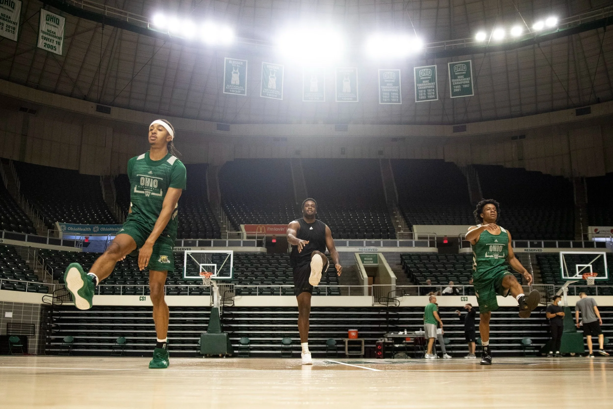  Sam Towns (11, left), Dwight Wilson III (4, center) and Michael Brown (14, right) warmup with dynamic stretching prior to practice. These dynamic stretches get the blood flowing and muscles loose prior to a hard practice.  