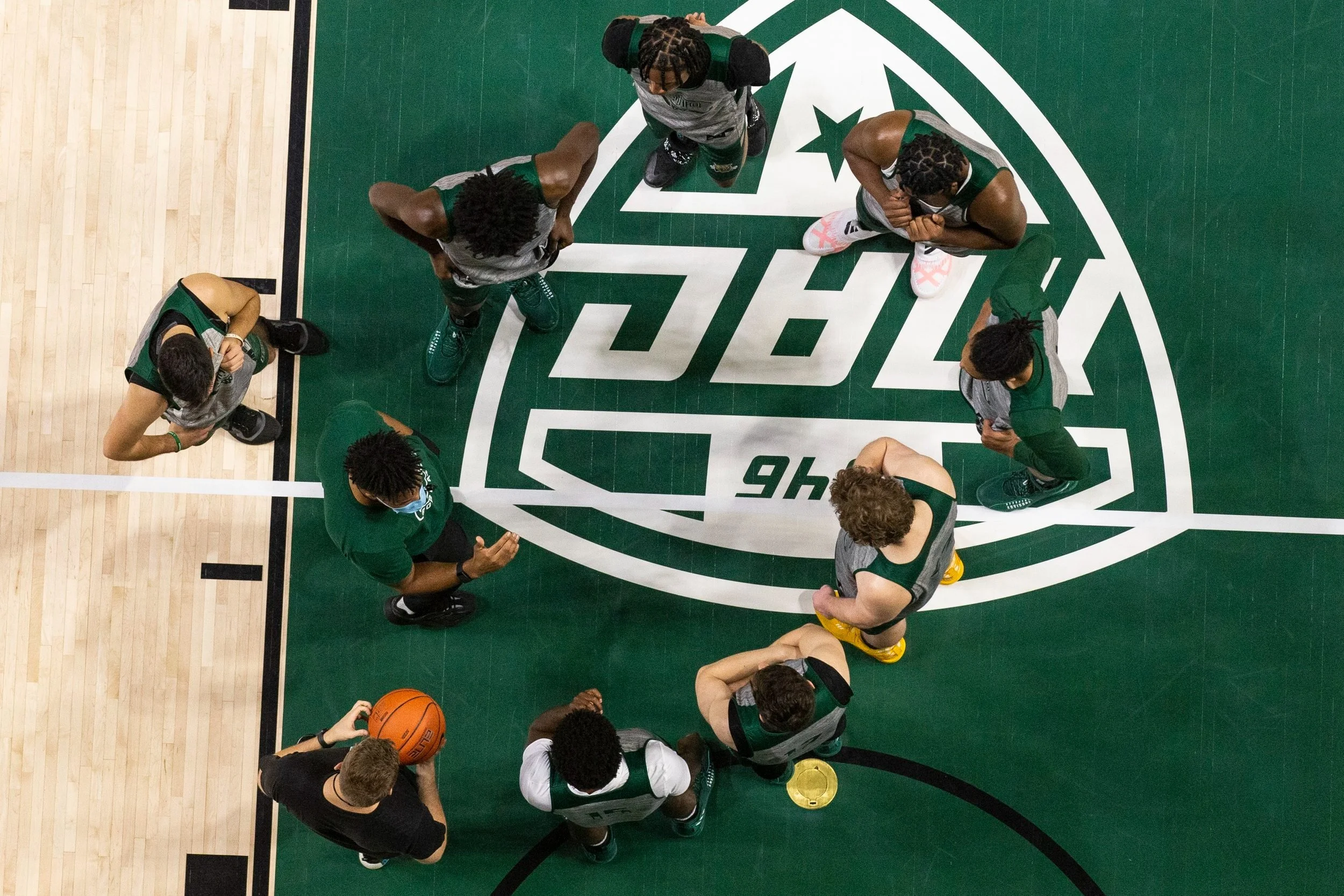  Lamar Thornton walks the team through a defensive set prior to a half court scrimmage between the first and second teams.  