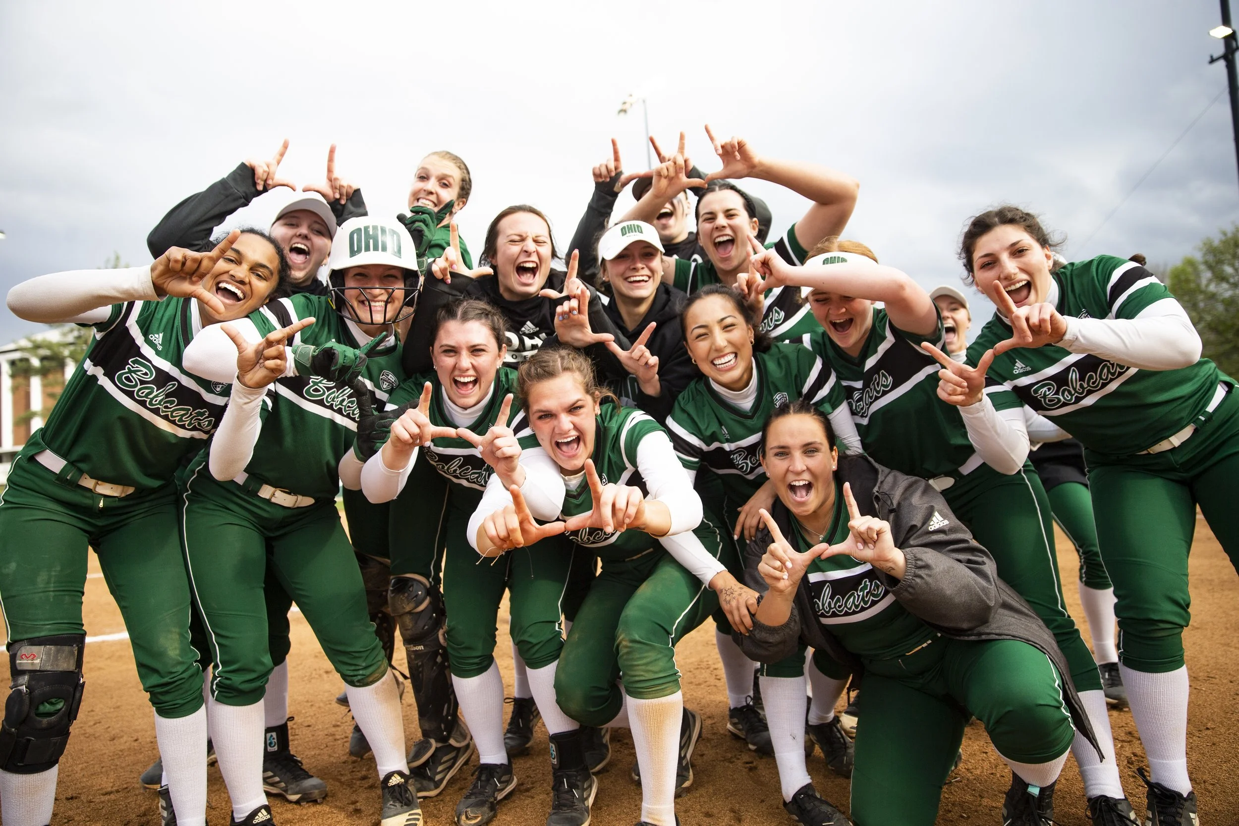  The Ohio Bobcats softball team celebrates after a walk-off home run from outfielder Caitlin Fouge (11) in the game against the Central Michigan Chippewas on Saturday, April 16, 2022.  