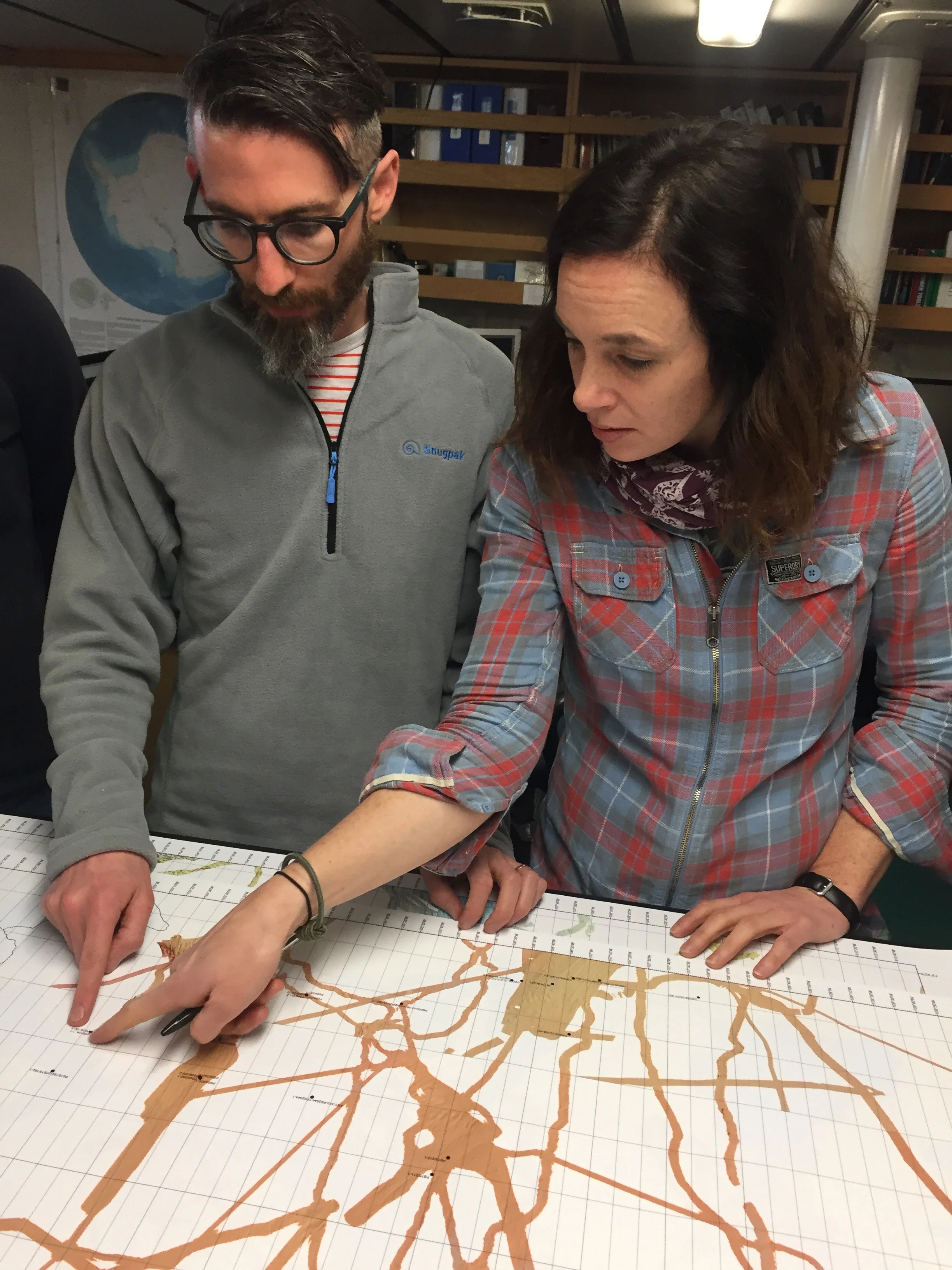 Ali Graham and Kelly Hogan examining bathymetry data.