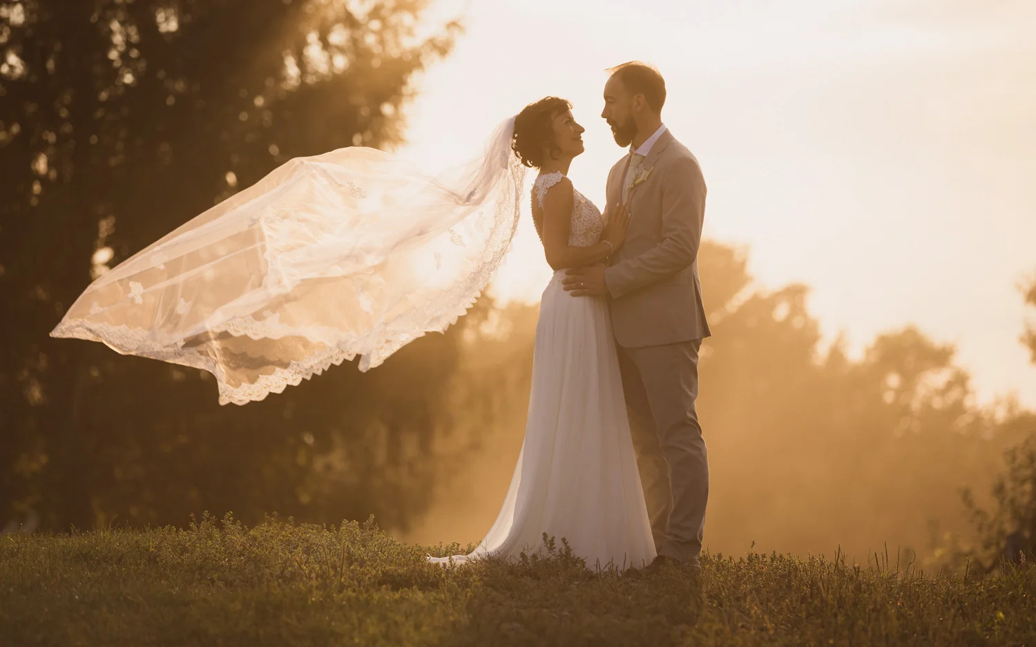 Candid sunset moment at Domaine de Dunham as the veil dances in the light.