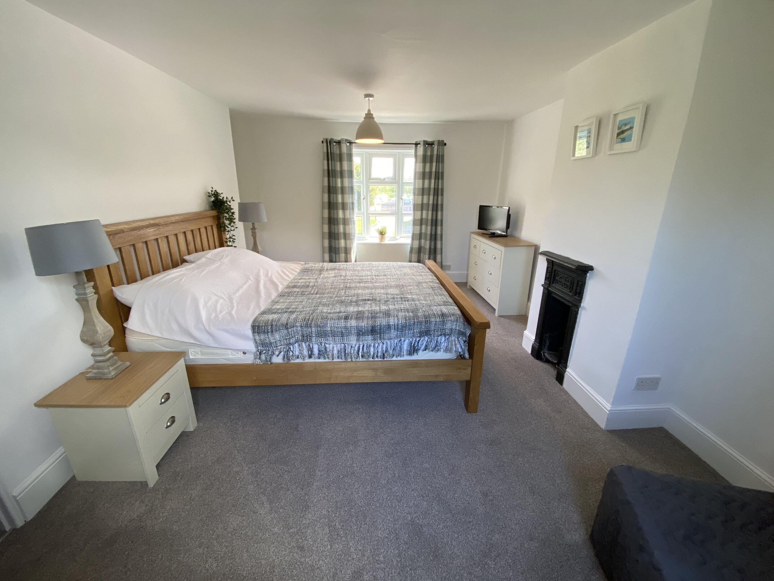 Master bedroom - King size at East Cottage, Walnut Farm Waxham