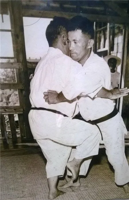 Miyagi Chojun Sensei grappling with Miyazato Eiichi Sensei; evidence of tegumi's overlap with karate.