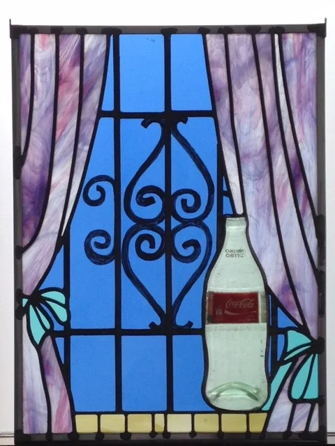Rochele Gomez, Coke Bottle, 2018, stained glass, lead came, zinc came, solder, cement, slumped Coke bottle, 24 x 18 inches