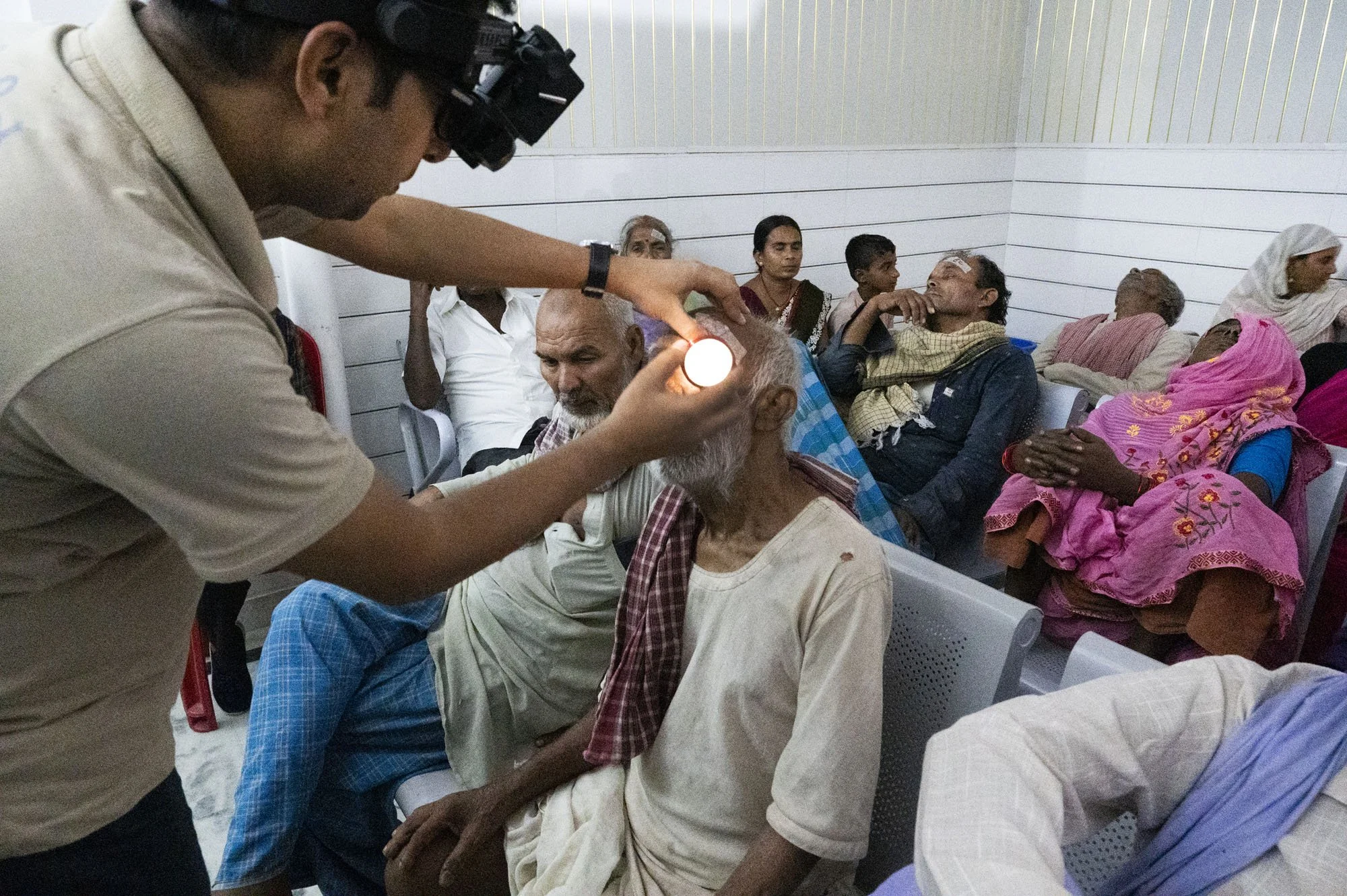 A familar voice informs him that he will check the back of his eye - ophthalmUmesh examines with an indirect ophthalmolscope which gives a good view of the retina.