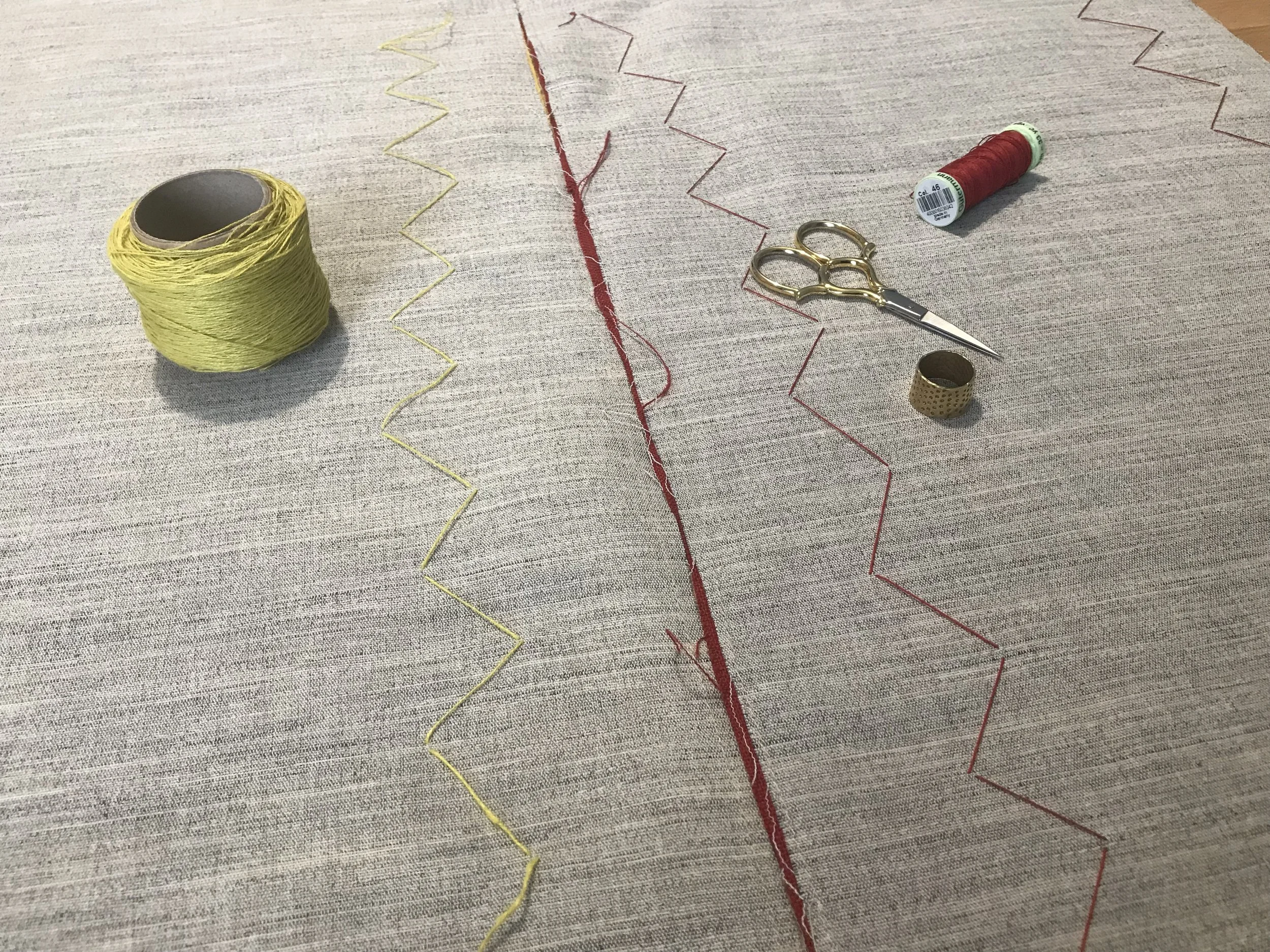 Pad stitching - tiny stitches on the outside that hardly show but hold the outer linen in place