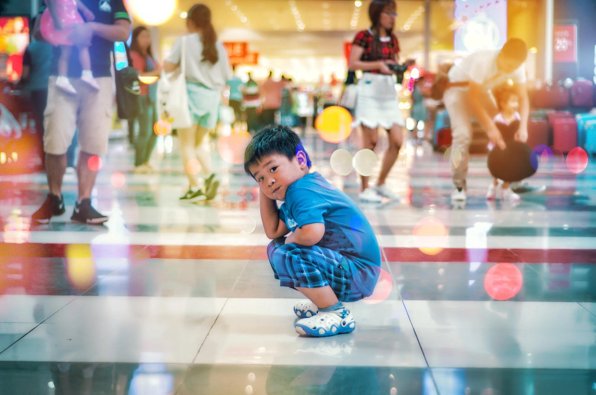 Canva - Boy Squating on White Floor Tile.jpg