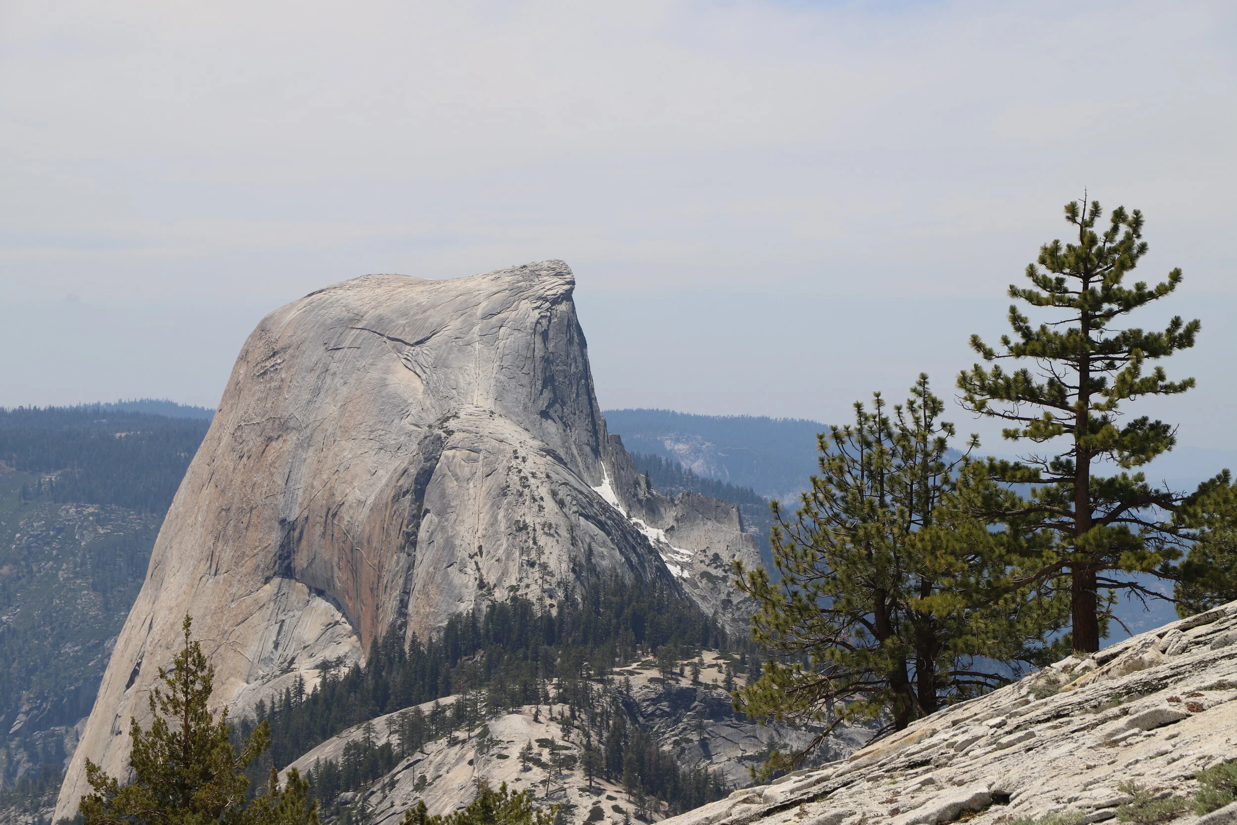Half Dome as visible from hiking down the trail from Cloud’s Rest. The cables are on the right side of the mountain (closer towards the cliff face) if you are curious. You can see them in the picture if you look closely.