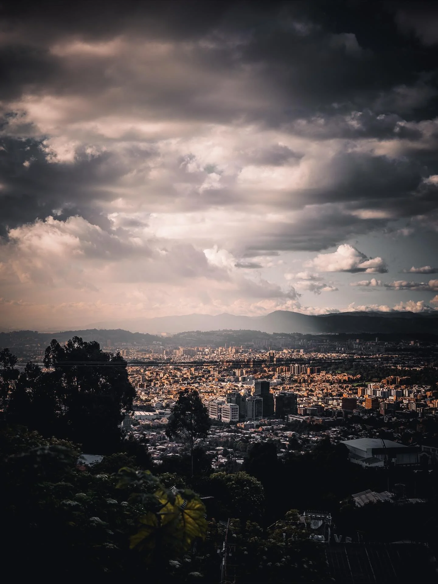 Bogot&aacute; glowing under a restless sky.
This city sits between light and shadow like it&rsquo;s part of a bigger story&mdash;mountains whispering in the distance, clouds moving like slow-motion waves.
Colombia doesn&rsquo;t just show you a view&h