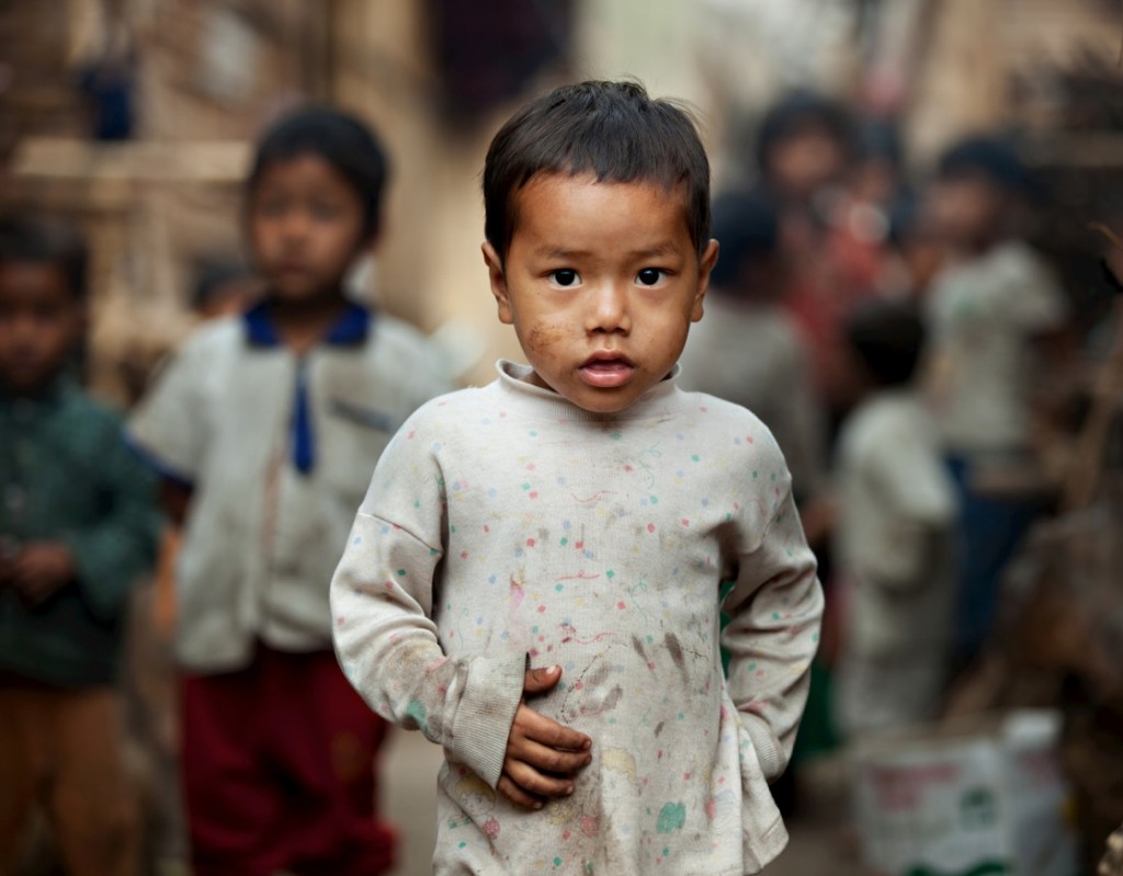 Ma Don and his friends wander down an alley between two huts in an IDP camp. He and his friends have grown up in the camp at the Burma/China border, and their childhood experience has only known war, oppression and homelessness. The oppression and killing of the Kachin minority group by the Burma/Myanmar army has been going on for decades but is often ignored by the international community.