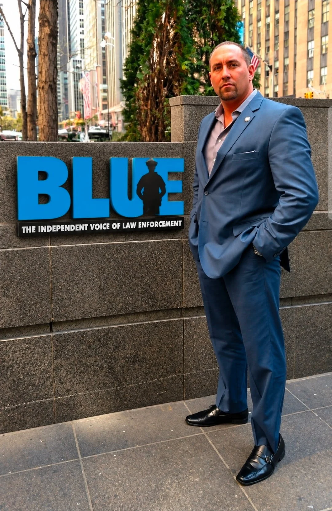 Jon welsh with BLUE sign.jpg