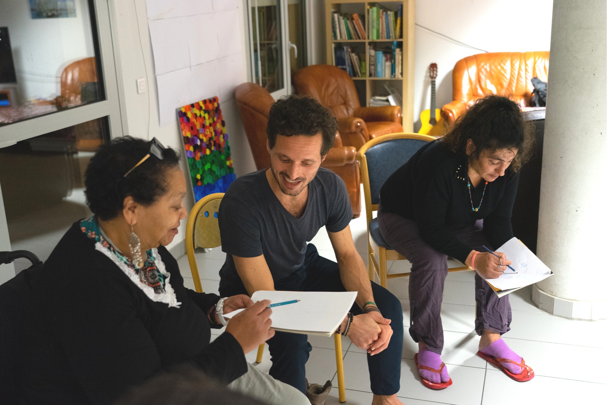 Nasera and Zineb during a sharing circle. Both live with psychic disorders. At the end of all our classes, we give to the participants the opportunity to share their thoughts and emotions with the rest of the group. In the above session, we talked about grounding and asked them to draw a tree that best represented them.