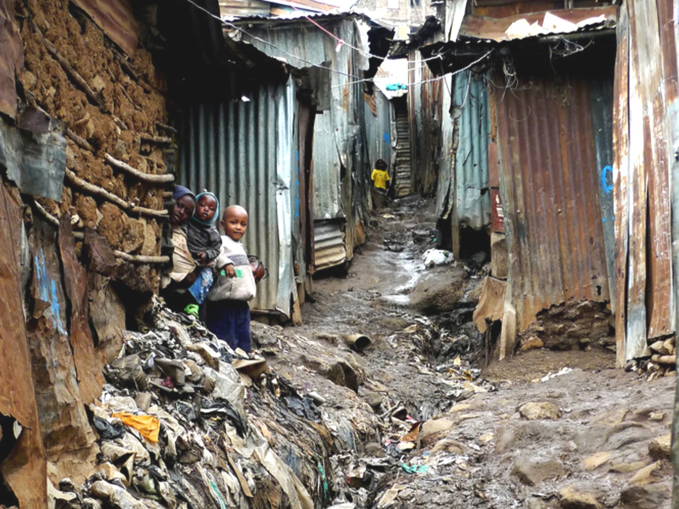 A passage in Mathare, Kenya's most overcrowded slum. Half a million people share barely 1 square kilometer in horrendous conditions. Life is set against a backdrop of poverty, anarchy, prostitution, lack of basic amenities, and a myriad of social complexities.
