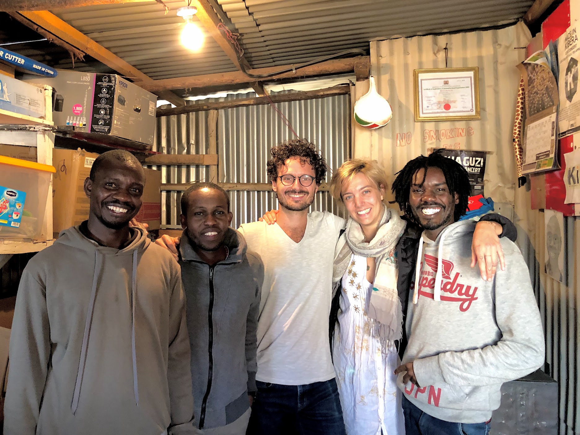 Kibera Creative Arts team, Charlotte and I during our first meeting at their office in Kibera.