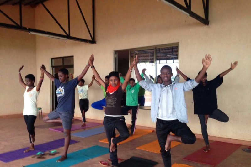 The residents of Agahozo-Shalom Youth Village during their weekly yoga class. Photo credits: Andreas Thoma.