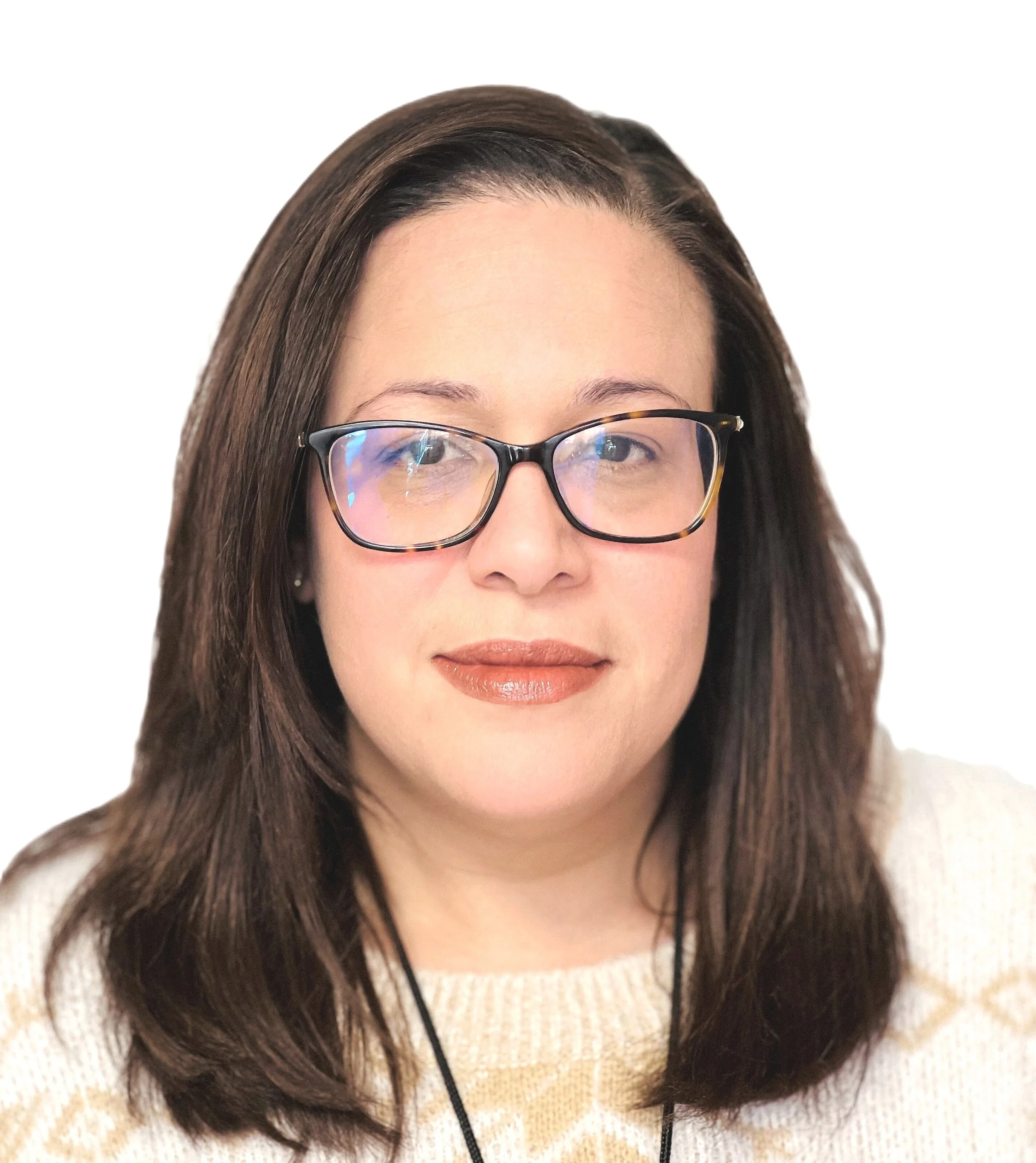 A woman with shoulder-length brown hair, wearing glasses with tortoiseshell frames, a beige sweater, and lipstick, looking at the camera against a white background.