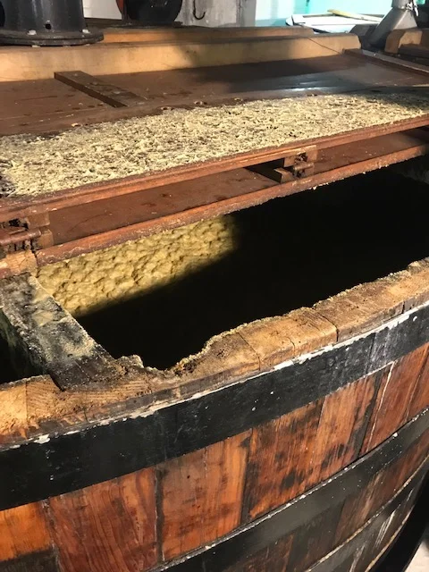 Mash under fermentation in traditional wooden washbacks