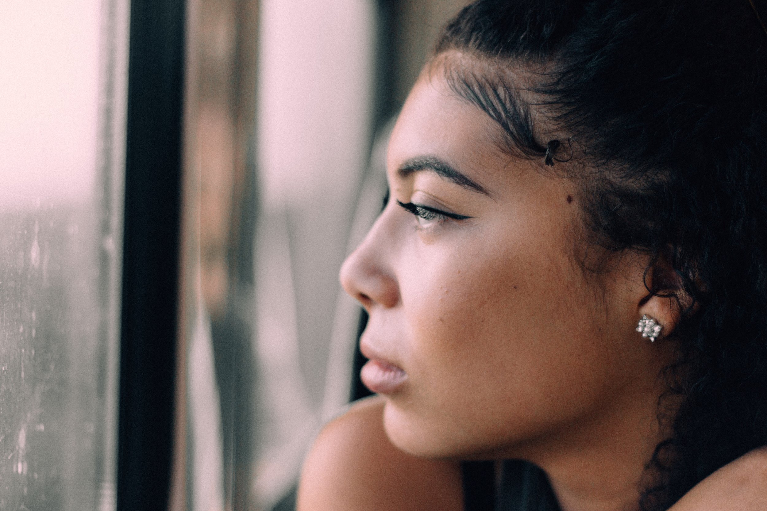 Mixed Woman Looking Out Window.jpg