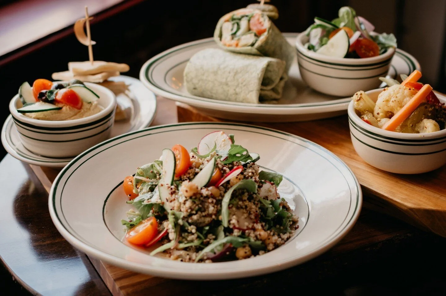 That happy hour feeling? We've got your back with half off beer, wine, and spirits Monday through Friday from 4pm to 7 pm. Pair it with a salad or wrap for a true treat!⁠
